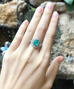 Emerald with Diamond Ring Set in 18 Karat White Gold Settings