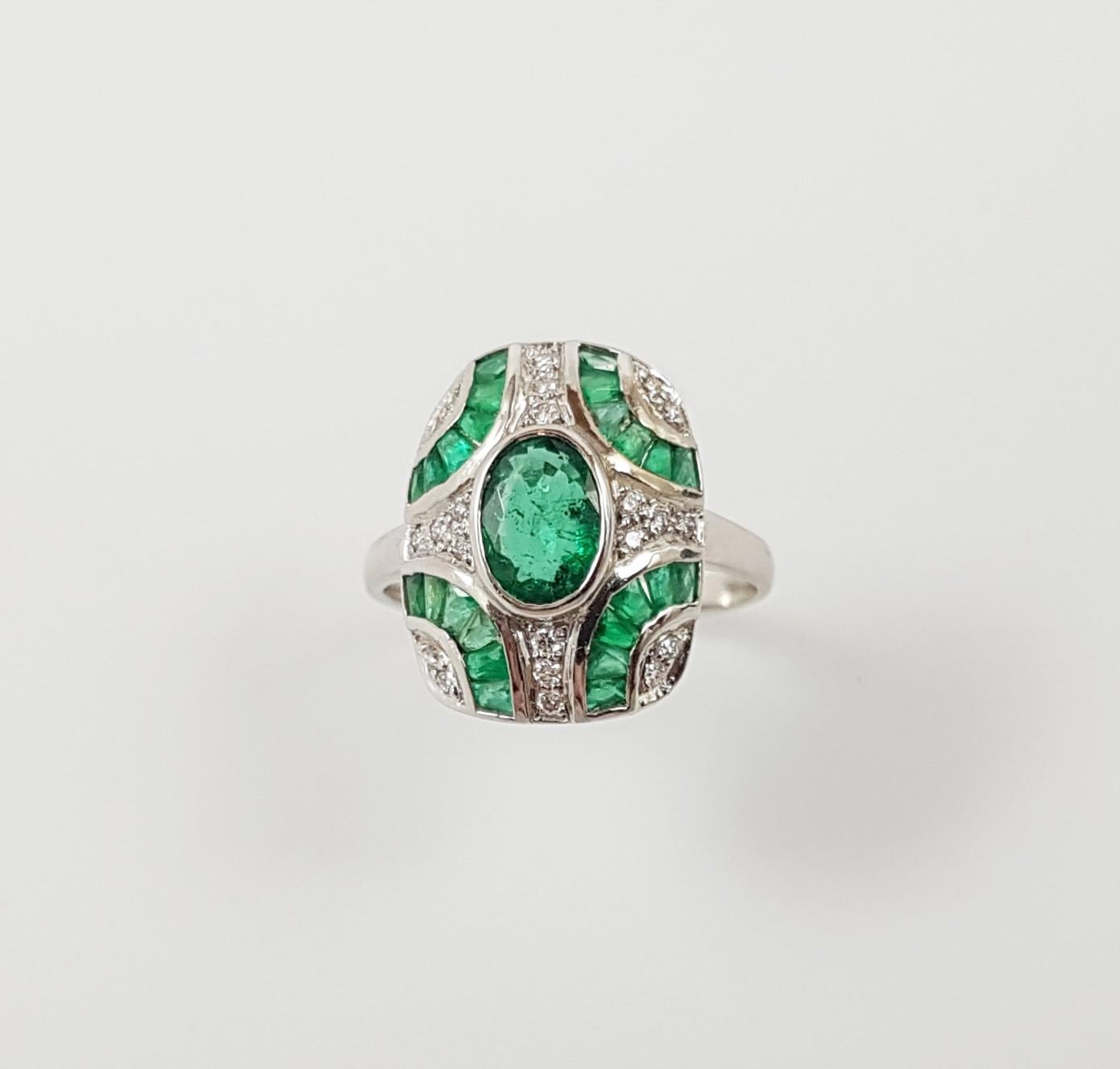 Oval Cut Emerald with Diamond Ring Set in 18 Karat White Gold Settings For Sale