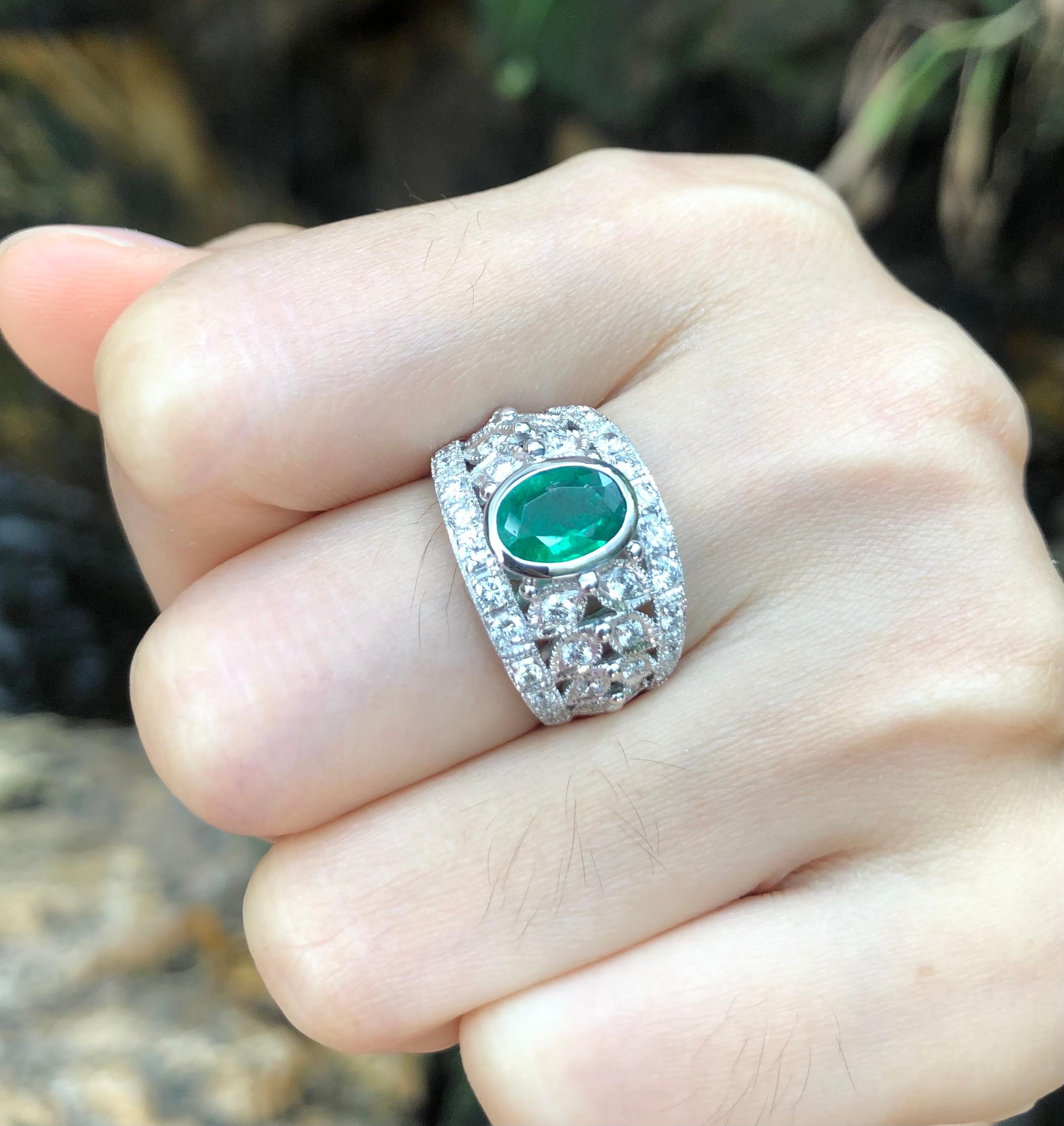 Oval Cut Emerald with Diamond Ring Set in 18 Karat White Gold Settings For Sale