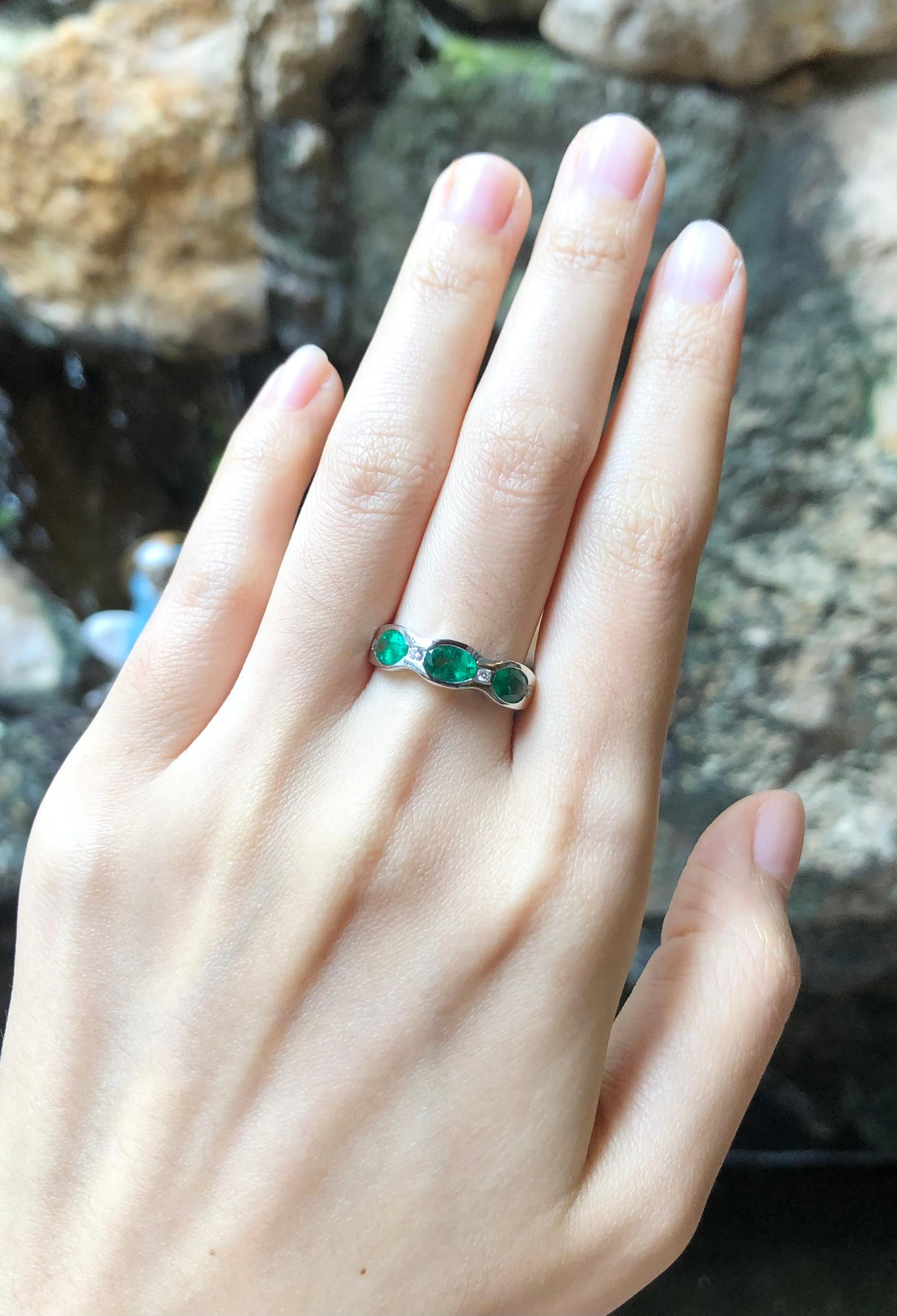 Contemporary Emerald with Diamond Ring Set in 18 Karat White Gold Settings For Sale