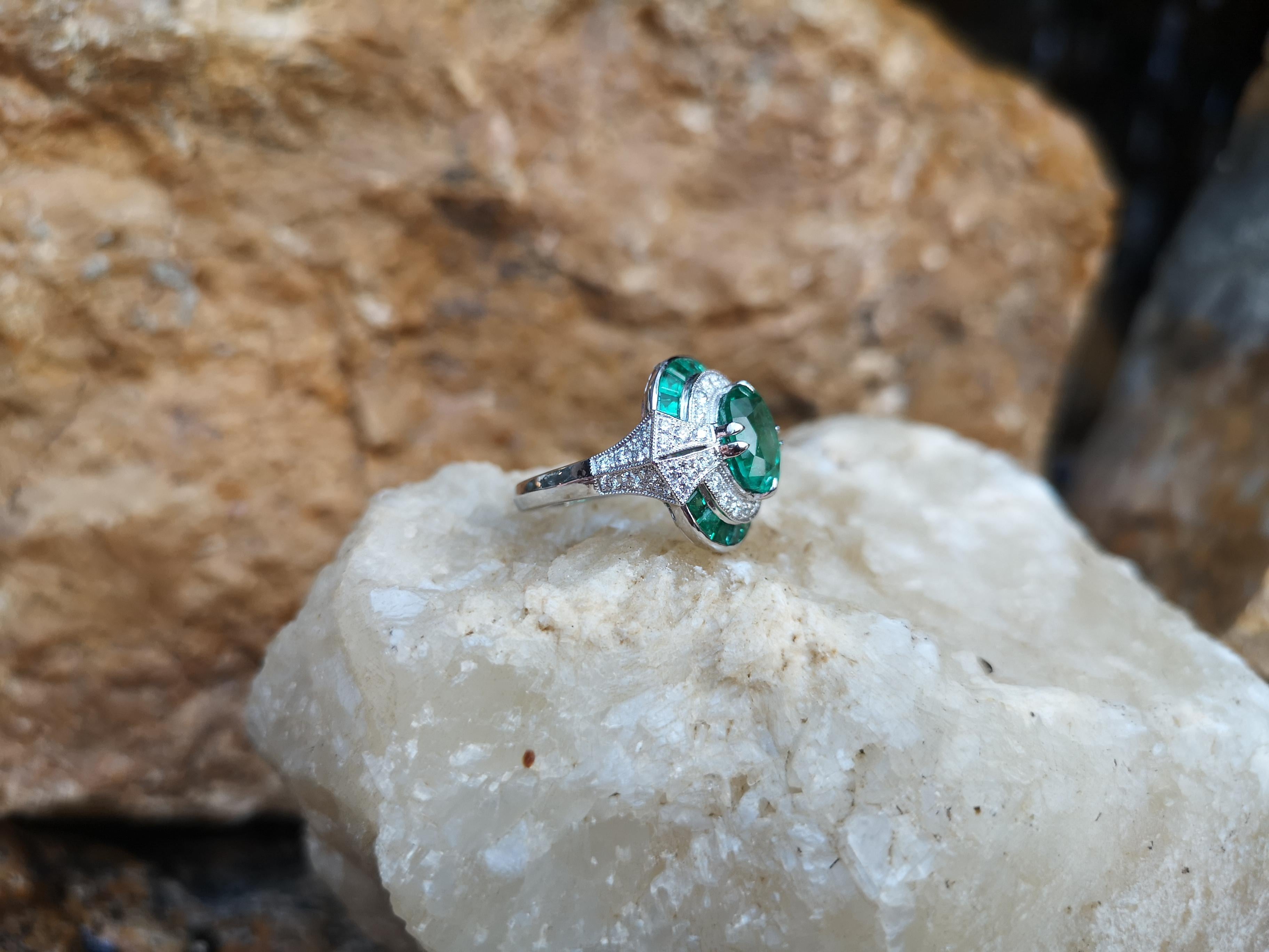 Oval Cut Emerald with Diamond Ring Set in 18 Karat White Gold Settings For Sale