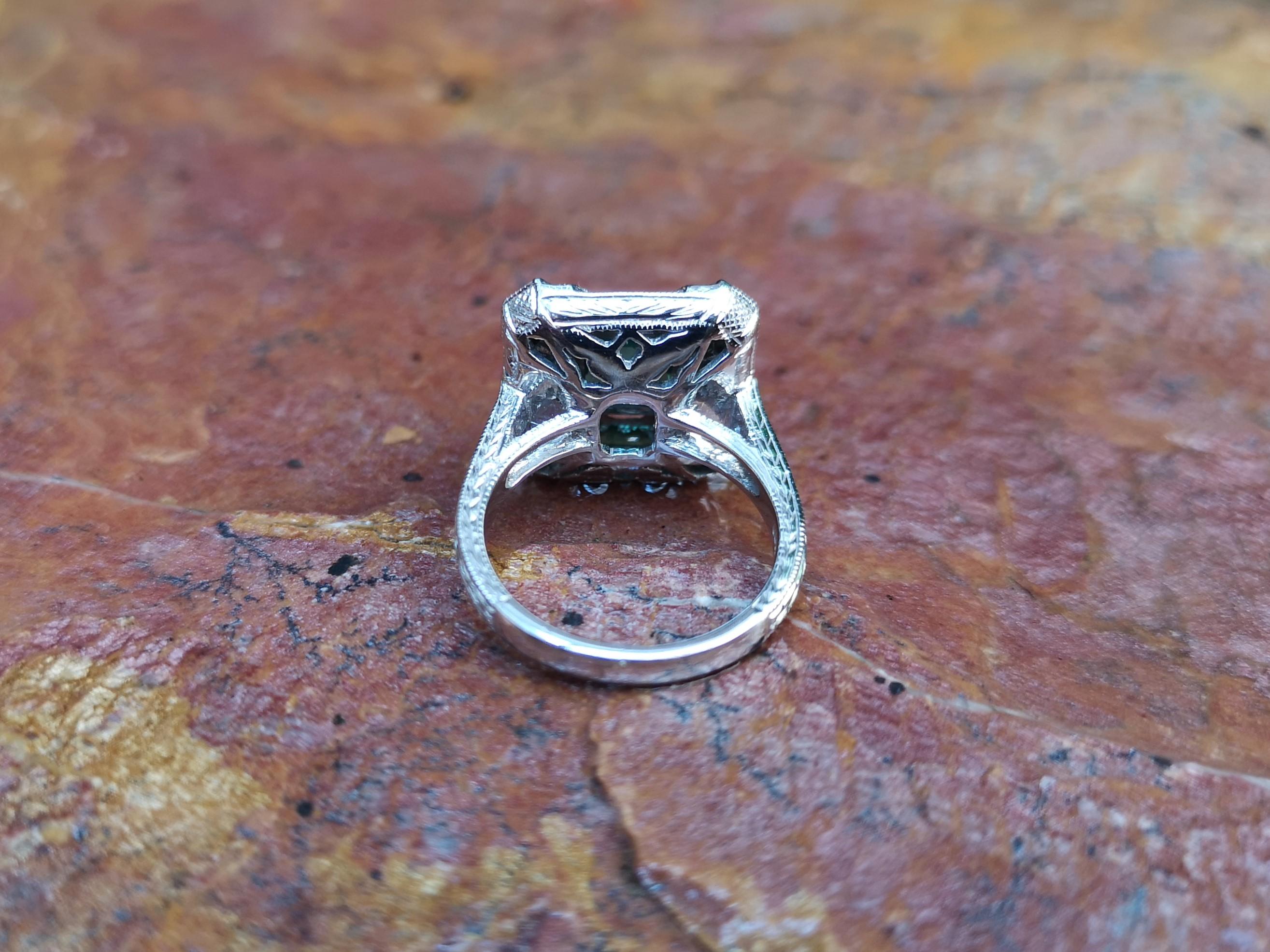 Emerald with Diamond Ring Set in 18 Karat White Gold Settings 2