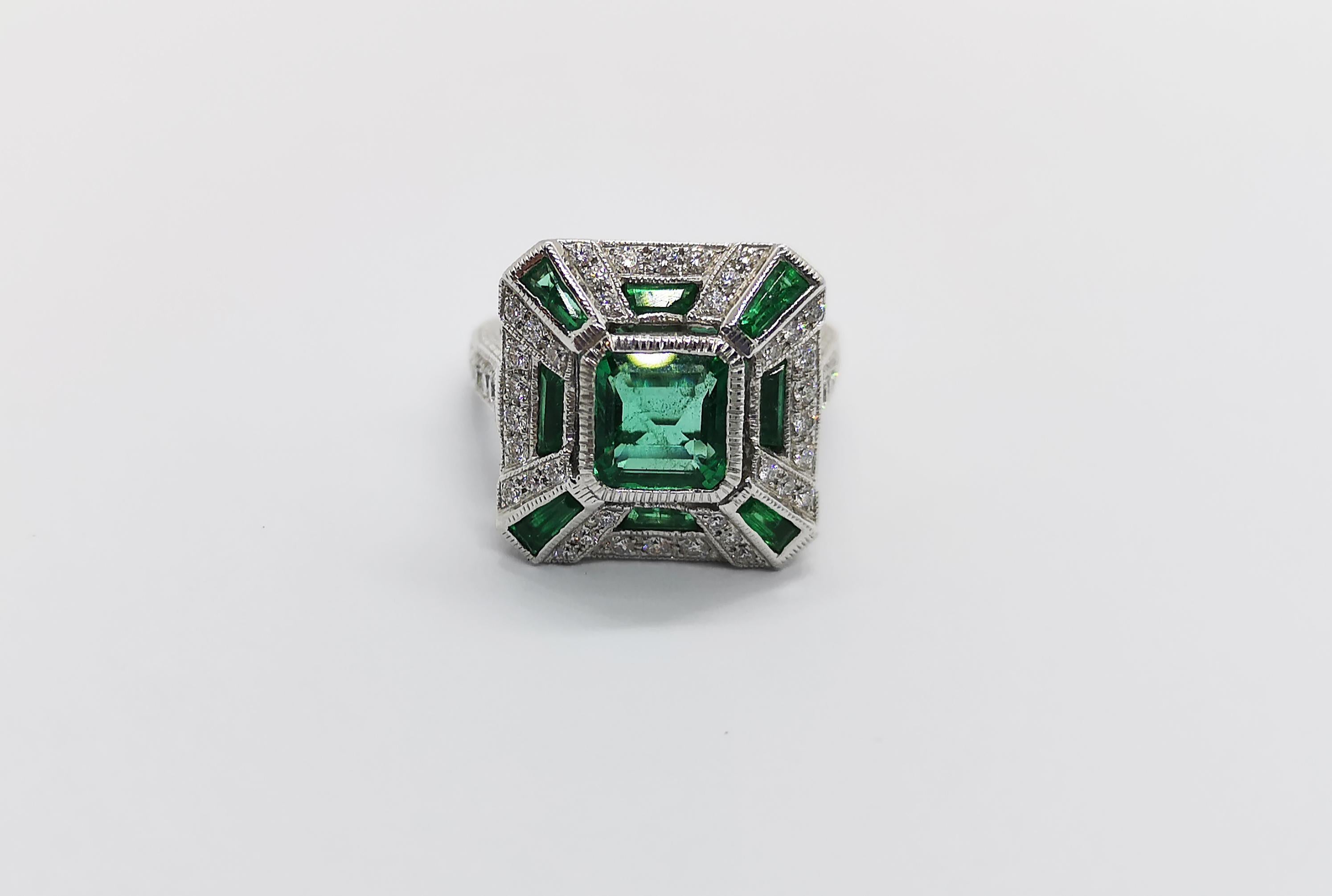 Emerald 1.10 carats, Emerald 1.0 carat with Diamond  0.40 carat Ring Set in 18 Karat White Gold Settings 

Width: 1.5 cm
Length: 1.5 cm 
Ring Size: 50

