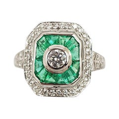 Emerald with Diamond Ring Set in 18 Karat White Gold Settings