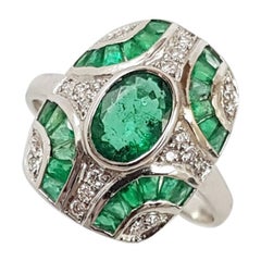 Emerald with Diamond Ring Set in 18 Karat White Gold Settings