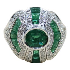 Emerald with Diamond Ring Set in 18 Karat White Gold Settings