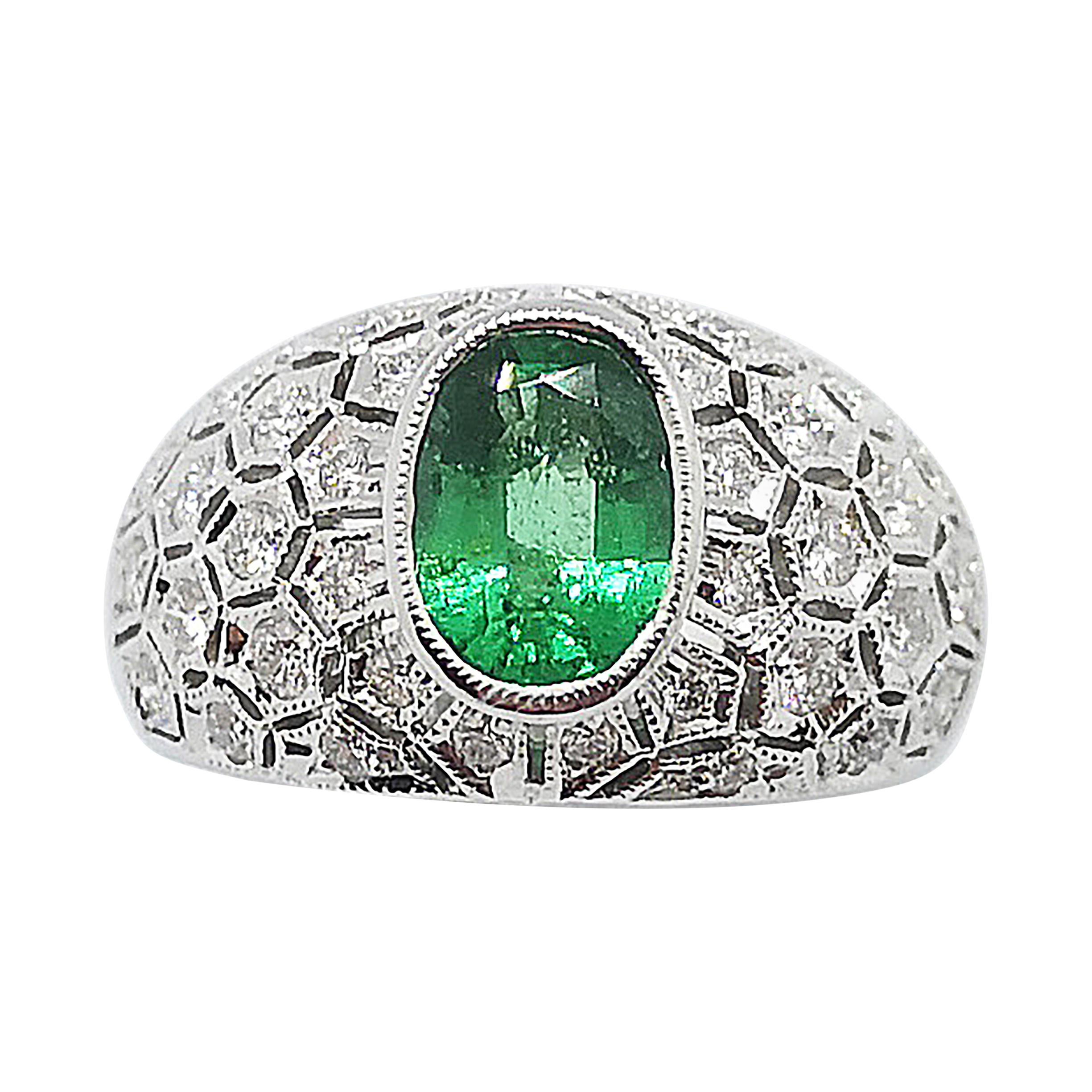 Emerald with Diamond Ring Set in 18 Karat White Gold Settings