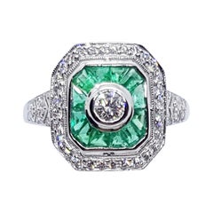 Emerald with Diamond Ring Set in 18 Karat White Gold Settings
