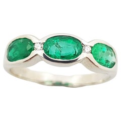 Emerald with Diamond Ring Set in 18 Karat White Gold Settings