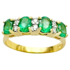 Emerald with Diamond Ring set in 18K Gold Settings