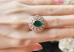Emerald with Diamond Ring set in 18K Rose Gold Settings