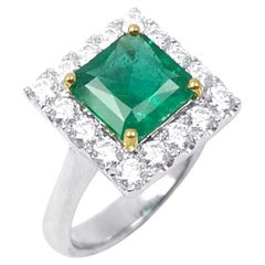 Emerald with Diamond Ring set in 18K White Gold Settings
