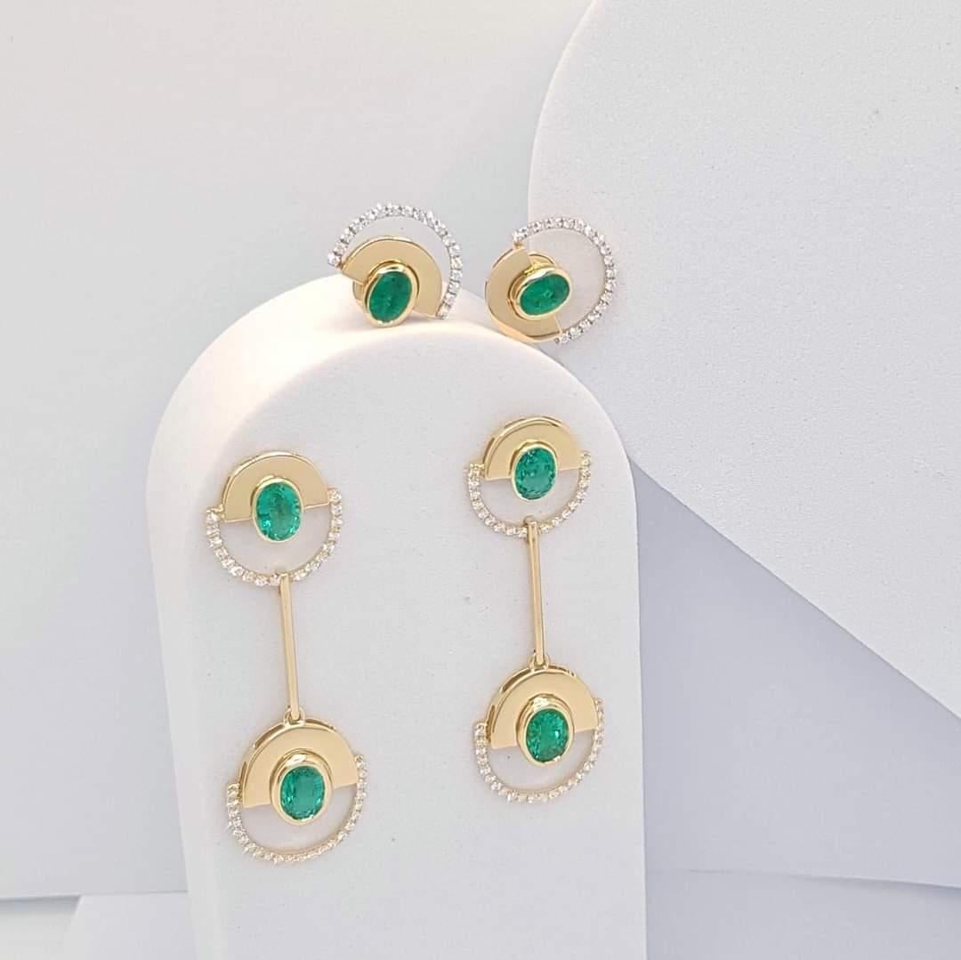 Women's Emerald with Diamond Twist Reflection Earrings set in 18K Gold  Settings  For Sale