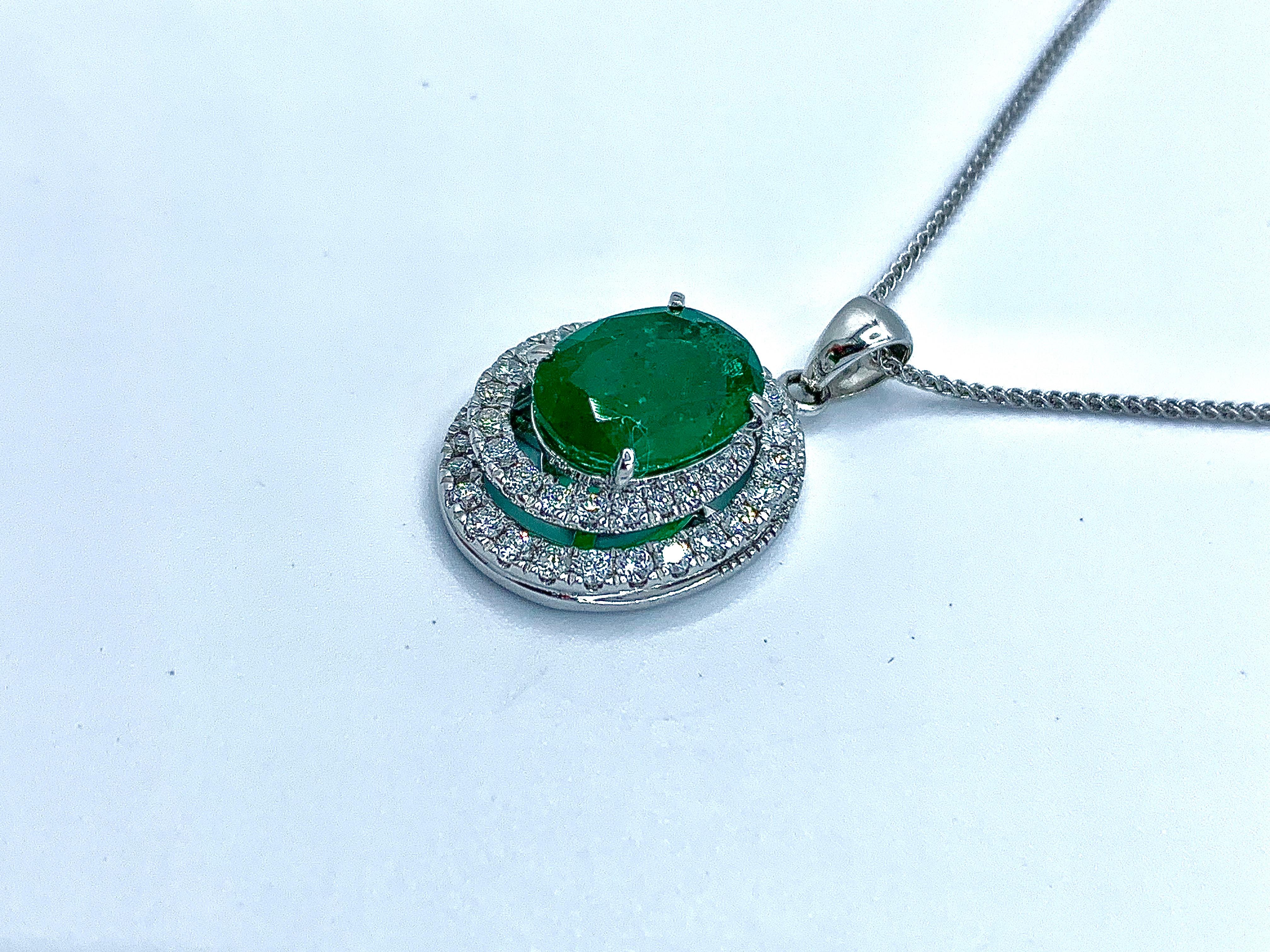 Oval Cut Emerald with Dimond Spiral Halo Pendant For Sale