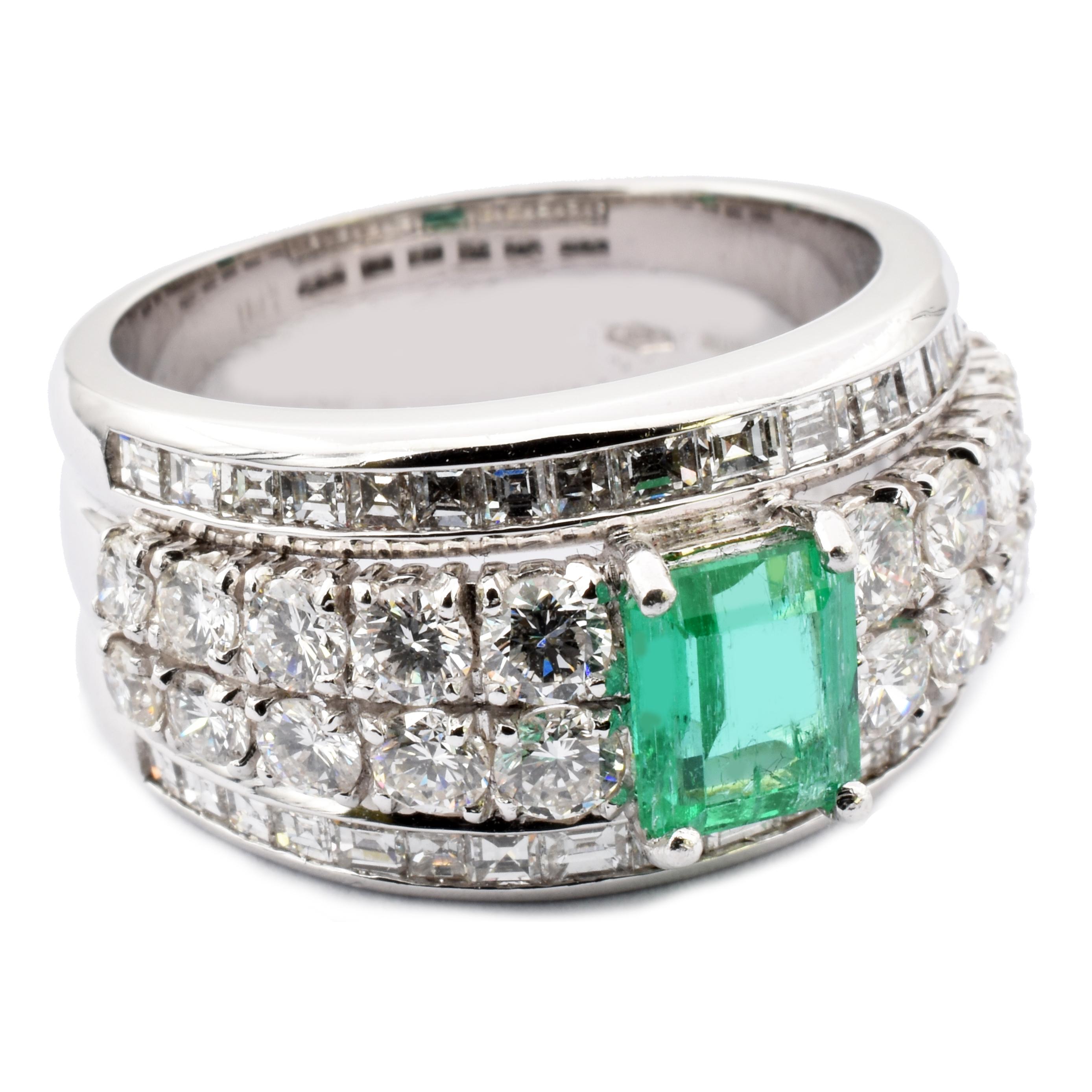 Gilberto Cassola 18Kt White Gold Ring with an Octagonal Cut Bright Green Natural Colombia Emerald. 
This Ring has 10 Brillant Cut Round Diamonds on each side of the Emerald and 2 rows of Baguette Cut Diamonds.
Natural Colombia Emerald ct 0.79 mm