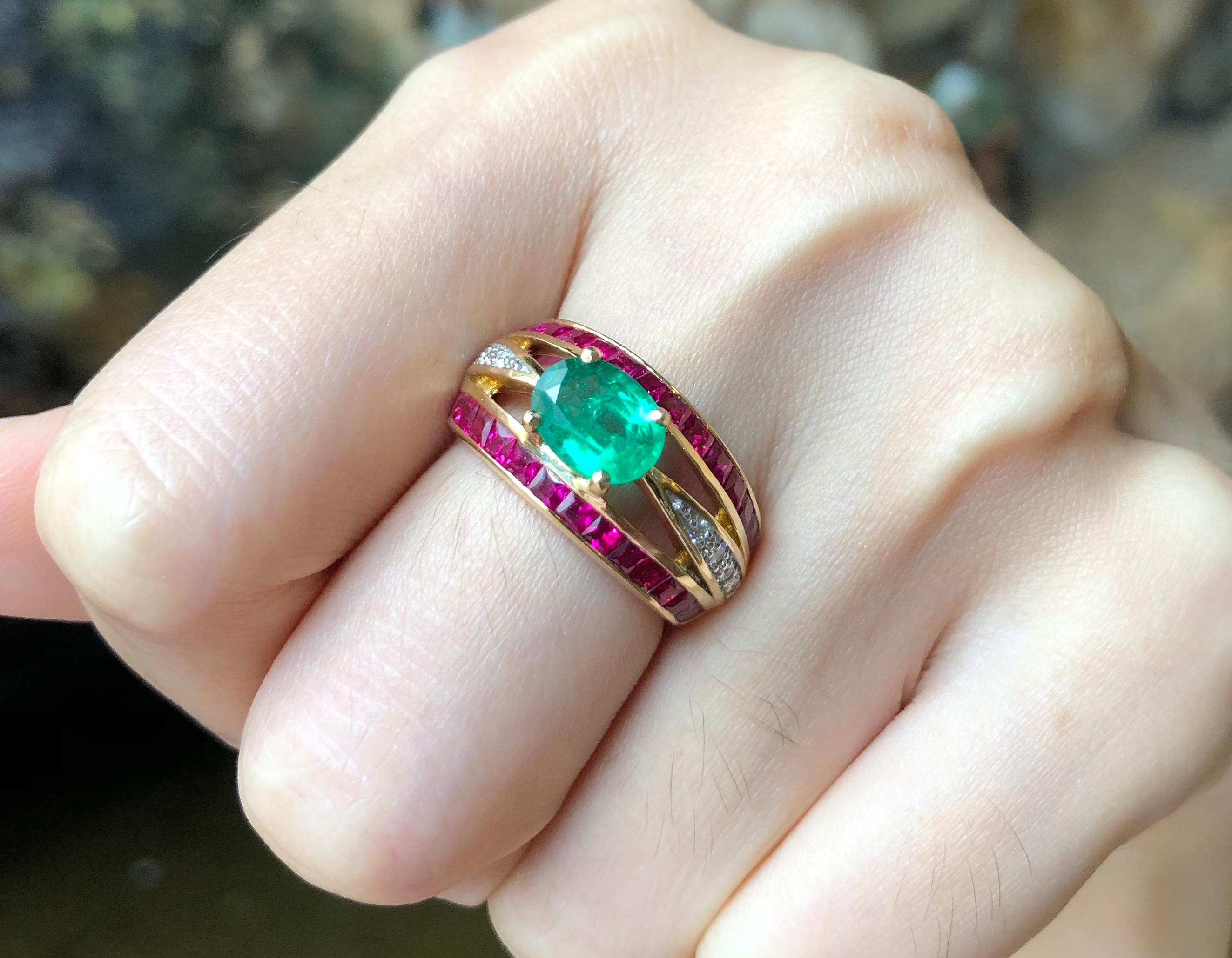 Emerald 1.05 carats with Ruby 1.95 carats and Diamond 0.14 carat Ring set in 18 Karat Gold Settings

Width:  2.0 cm 
Length: 1.1 cm
Ring Size: 52
Total Weight: 9.79 grams

Emerald 
Width:  0.8 cm 
Length: 0.5 cm

