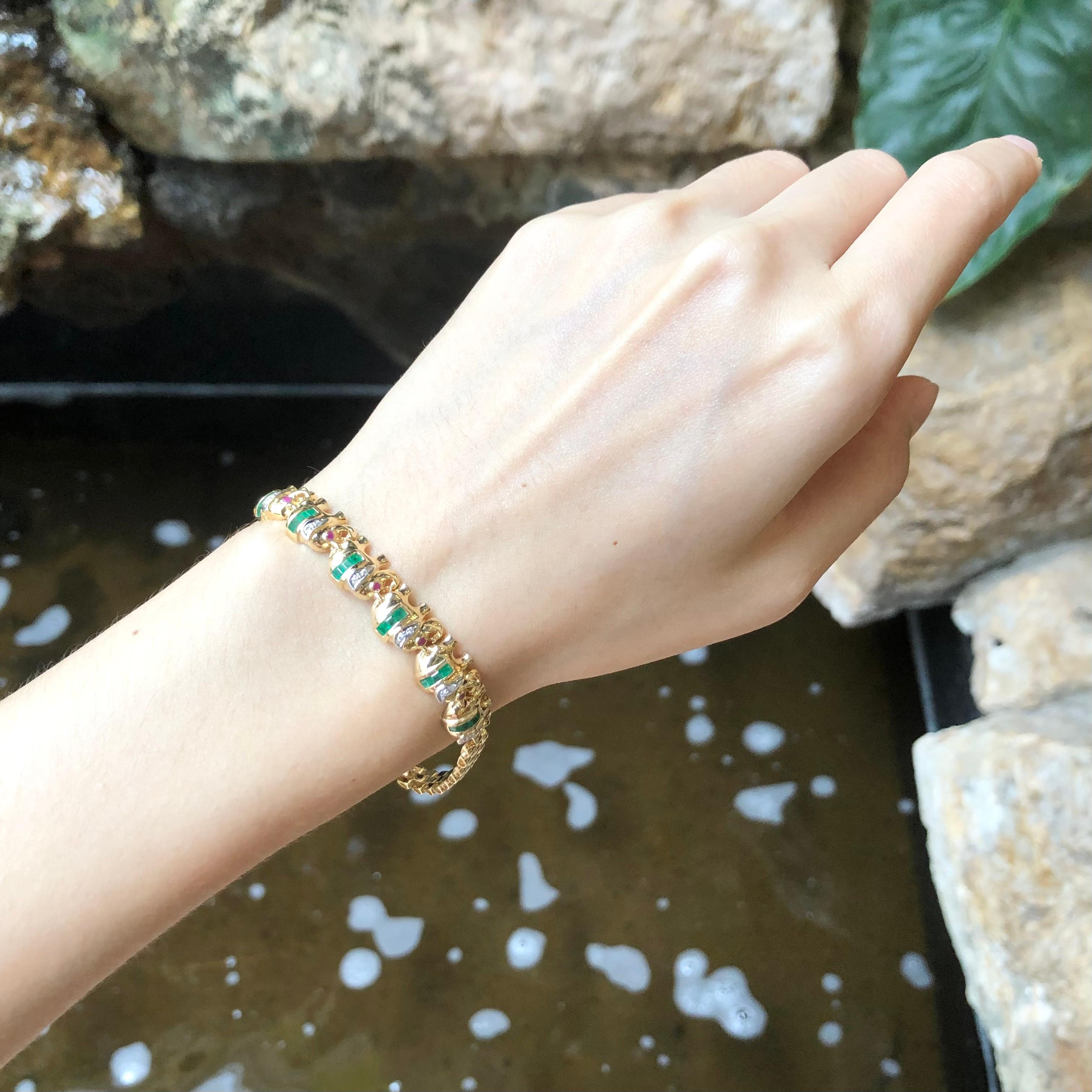 Emerald 0.67 carat with Ruby 0.08 carat Bracelet set in 18 Karat Gold Settings

Width:  0.9 cm 
Length: 18.5 cm
Total Weight: 15.58 grams

