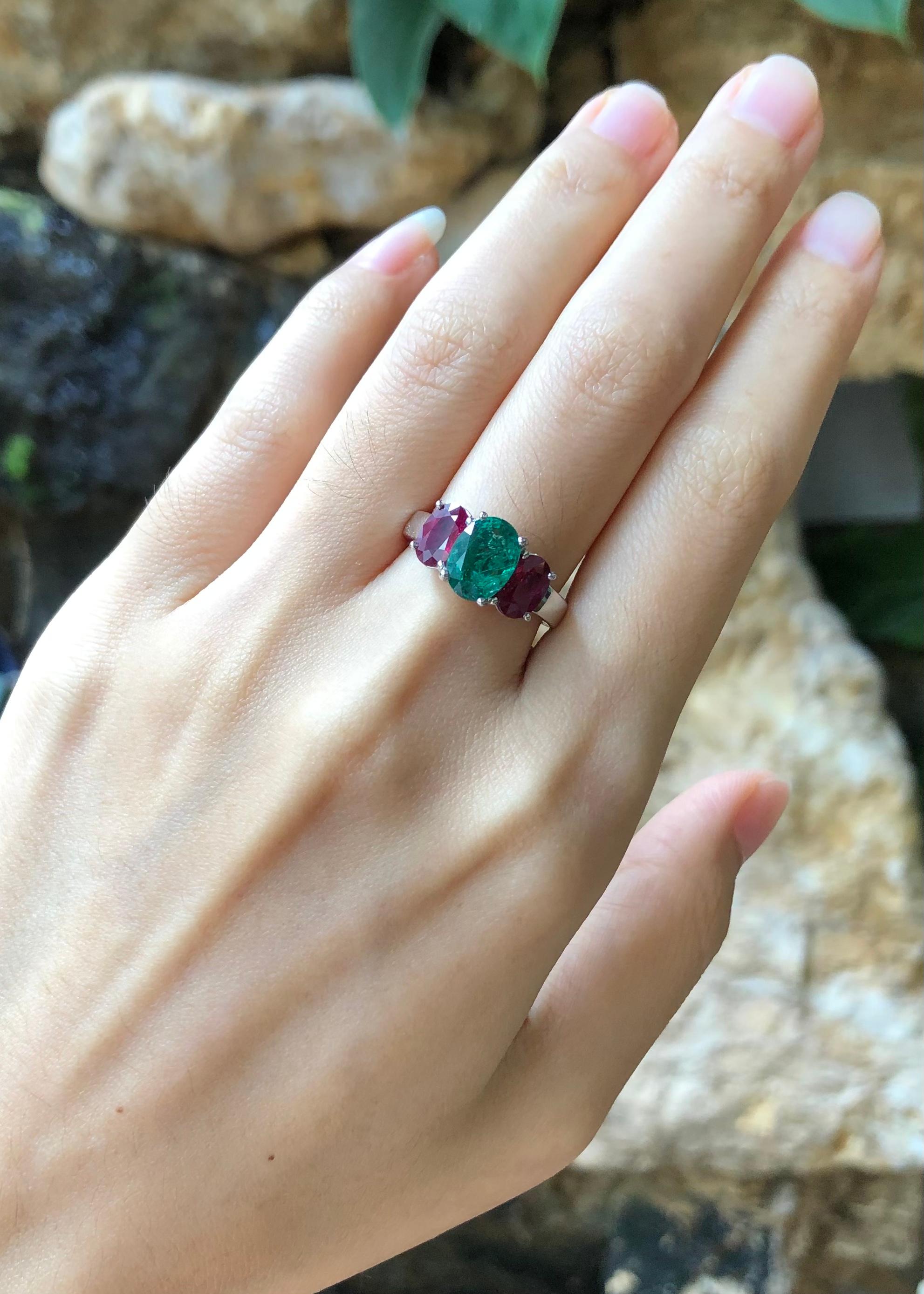 Emerald 1.74 carats with Ruby 2.01 carats Ring set in 18 Karat White Gold Settings

Width:  1.5 cm 
Length: 0.9 cm
Ring Size: 52
Total Weight: 6.52 grams

