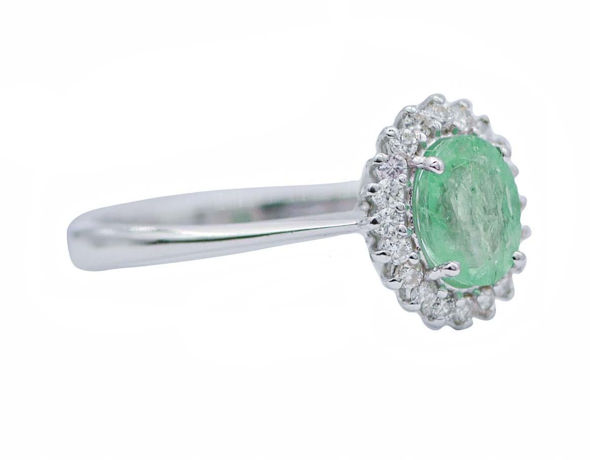Beautiful modern ring in 18 kt white gold structure mounted with a central emerald surrounded by a frame of diamonds.
Diamonds 0.25 ct
Emerald 0.91 ct -7 mm x 5 mm
Total Weight 2.70 gr
RF   G     GFGE
RK.AUGF
Italian Size 17.5
Usa Size 8.17
French