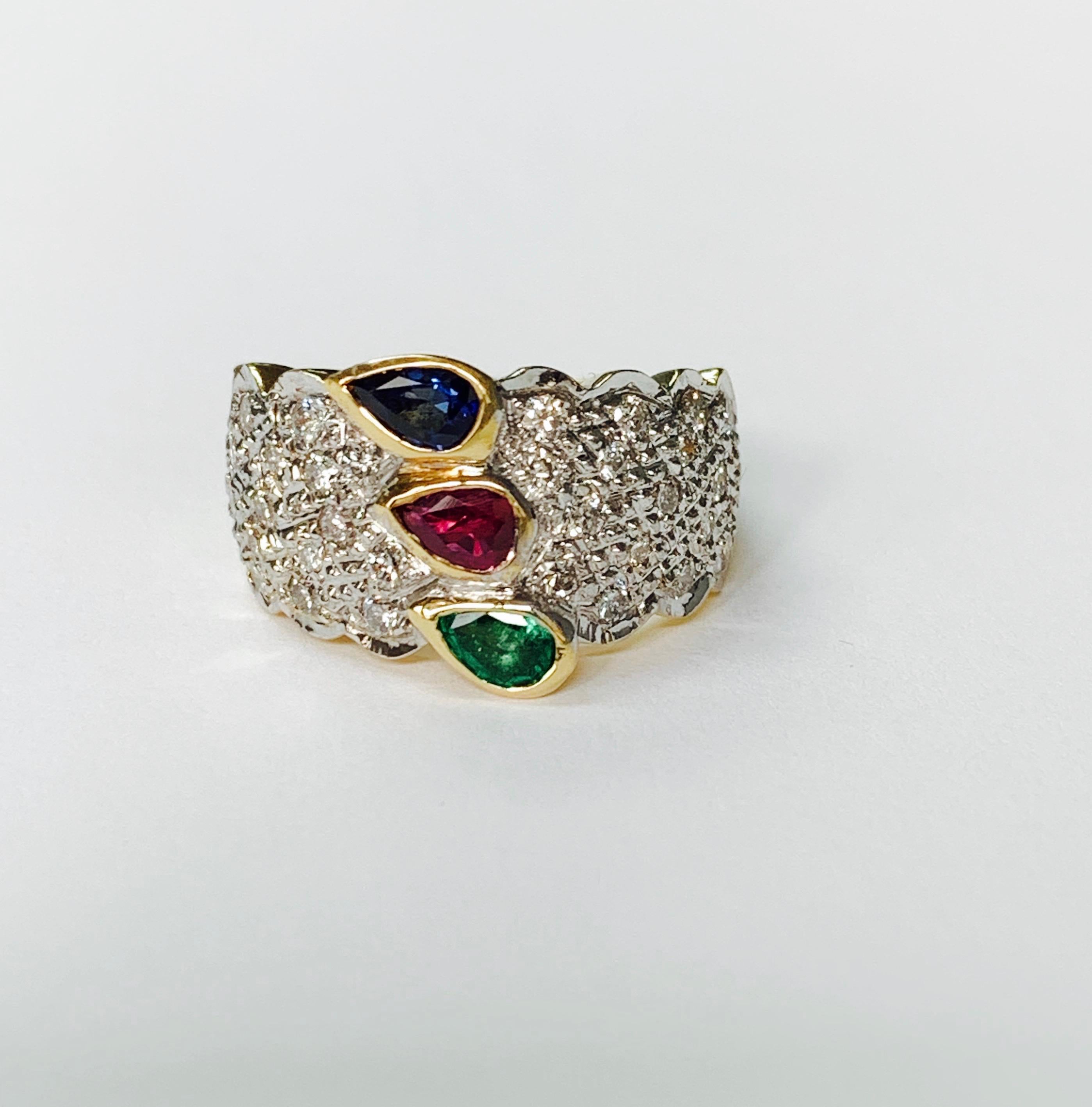 Emerald, Ruby, Blue Sapphire and diamond engagement ring handcrafted in 14k white gold. 
The details are as follows : 
Diamond weight : 0.82 carat 
Metal : 14k white gold 
Measurements : 0.50