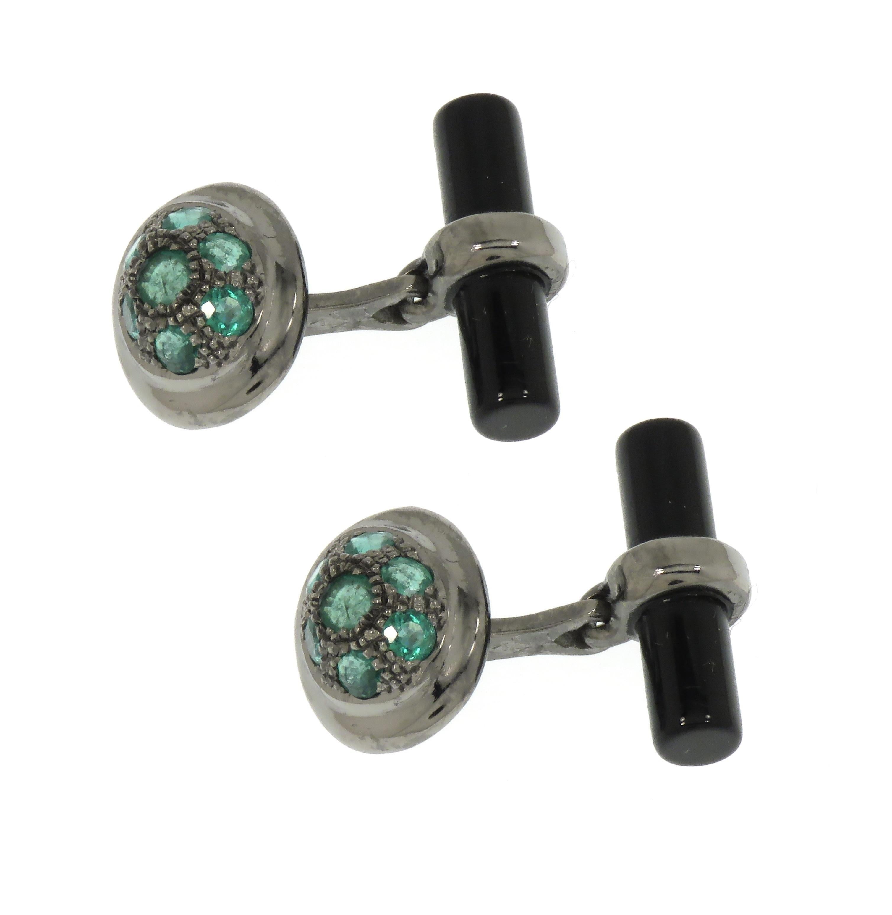 Beautiful cufflinks crafted in 9 karat white gold  black rhodium plating featuring 14 natural round cut green emeralds and two natural onyx bars. Oval front dimension is : 15x12 mm / 0.590x0.472 inches, back bar dimension is; 20x5 mm / 0.787x0.196
