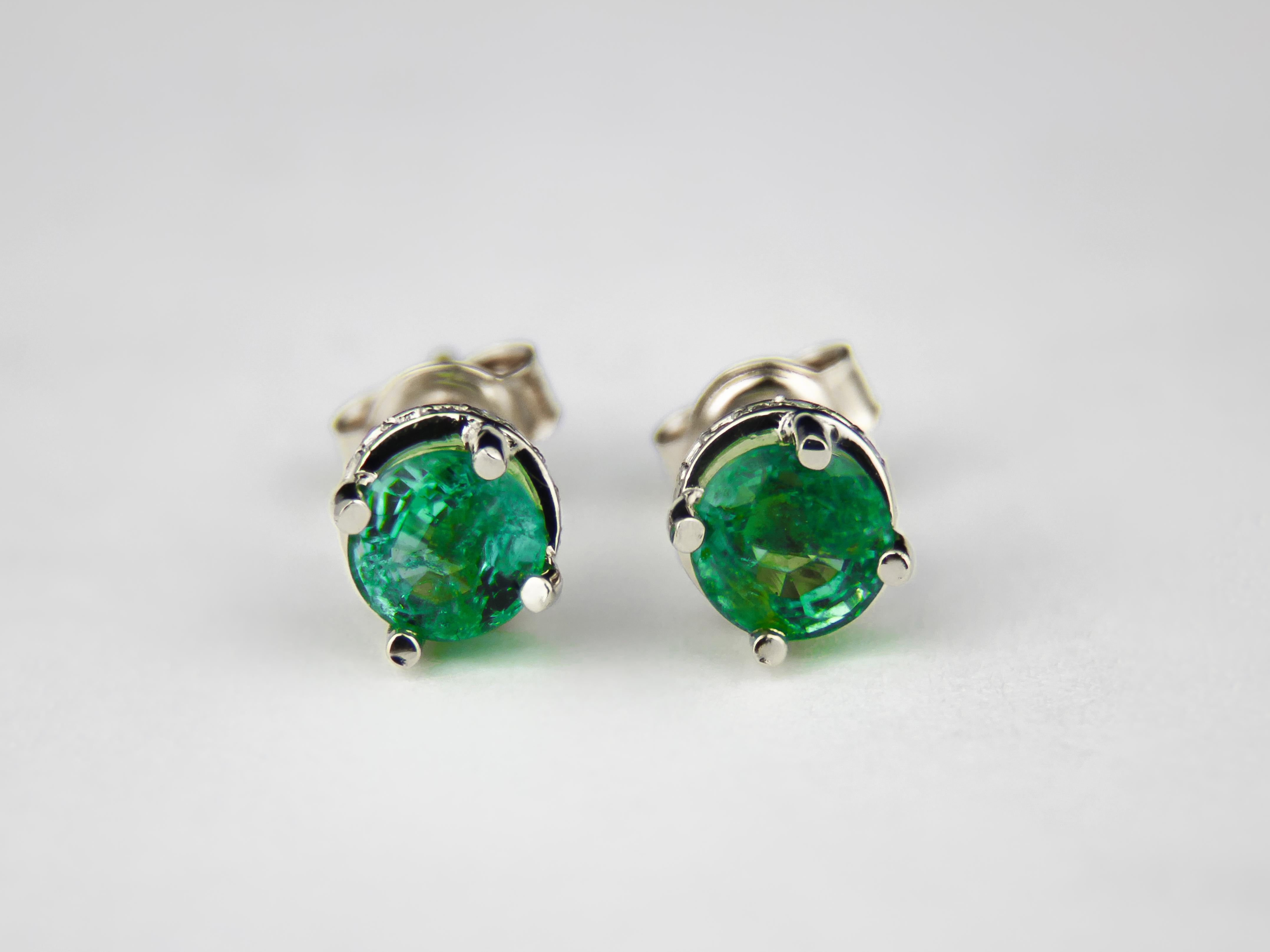Emeralds 14k gold earrings studs.  

Metal type: Gold
Metal stamp: 14k Gold
Weight: 2.2 gr
Central gemstones:
Natural emeralds
Round cut
Weight: aprox 1 ct
Color: green
Surrounding stones: diamonds, G\VS, round brilliant cut, 0.15 ct aprox.

 💍This