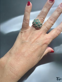 Emeralds and diamonds in 18-carat gold ring