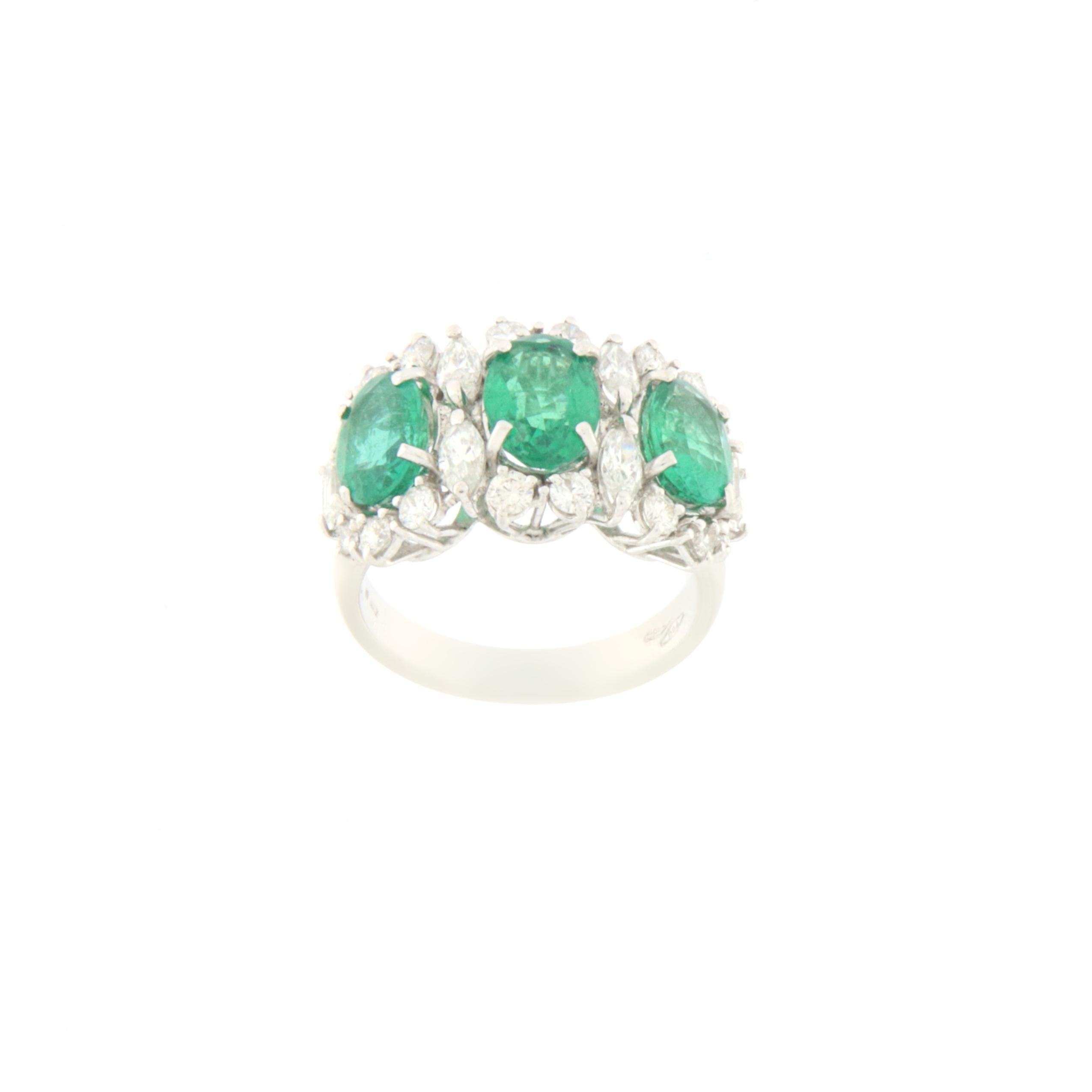 Beautiful 18 karat white gold cocktail ring. Handmade by our artisans composed with three emeralds and diamonds

Ring total weight 7.90 grams
Diamonds weight 1.52 karat
Emerald weight 3.63 karat
Ring size 16.5 ITA 7.75 US
(All rings can be resized