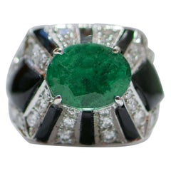 Emeralds, Diamonds, Onyx, 14 Karat White Gold Ring. Emeralds, Diamonds, Onyx, 14 Karat White Gold Ring.