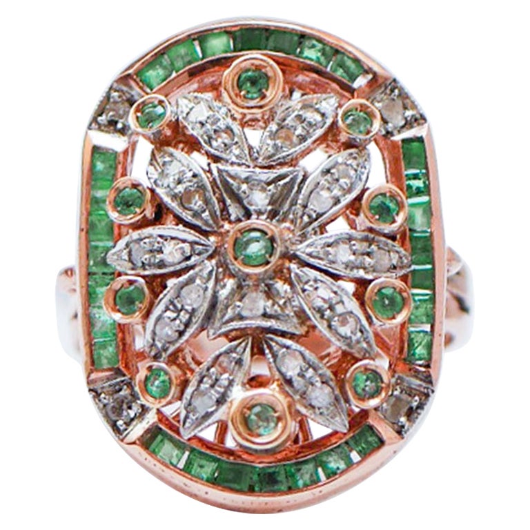 Anello con smeraldi, diamanti, oro rosa e argento.
