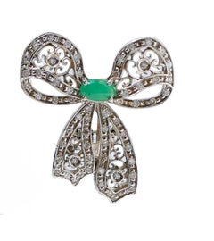 Emeralds, Diamonds, White Gold Bow Earrings.