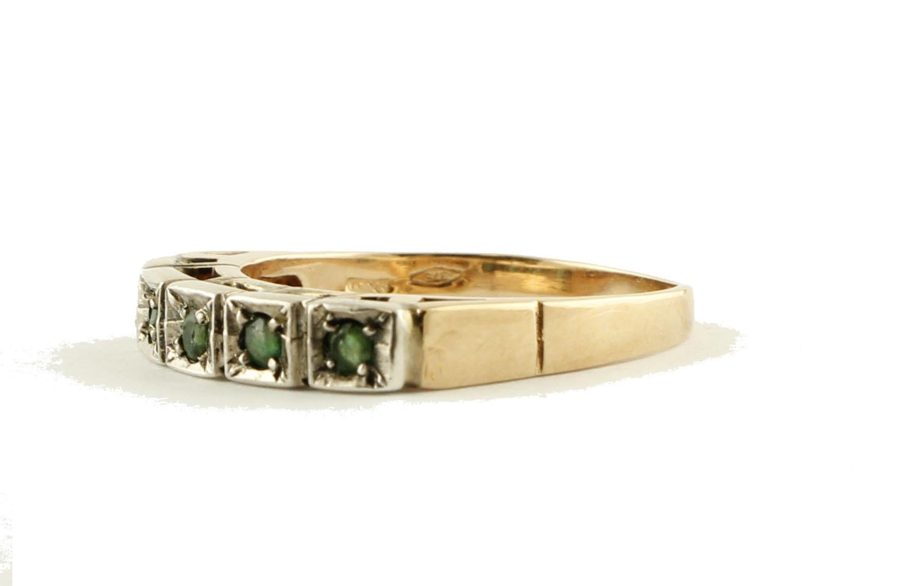 Fabulous band ring in 9K rose gold and silver mounted with 5 deep color little emeralds.
Emeralds 0.28 ct 
Total Weight 2.80 g 
R.F + ueg
Italian size 14
French size 54
Usa size 6.84

We hereby inform our customers that in the case of return they