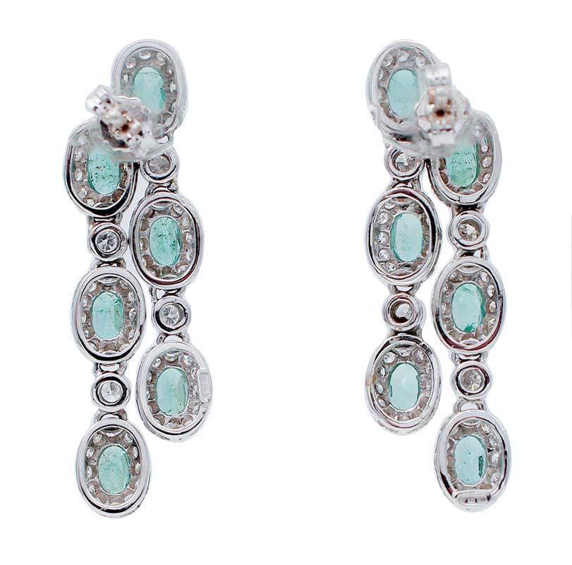 Retro Emeralds, Diamonds, 14 Karat White Gold Dangle Earrings.