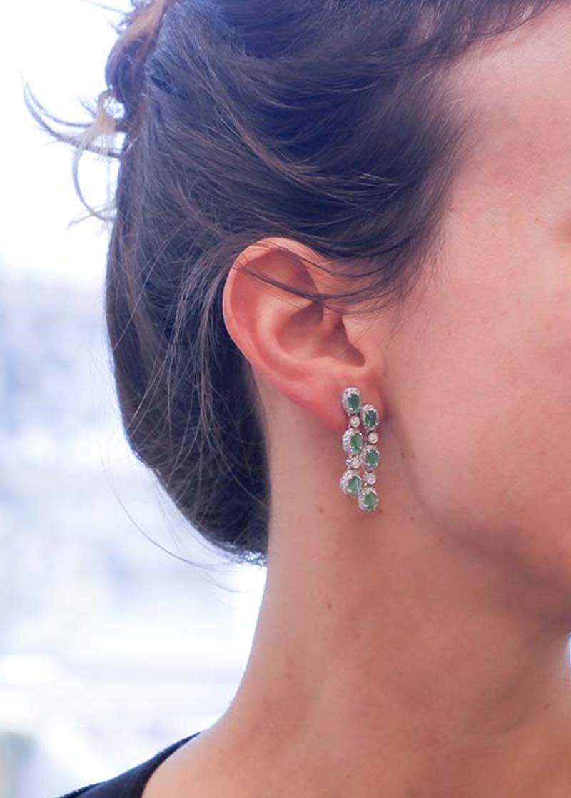 Emeralds, Diamonds, 14 Karat White Gold Dangle Earrings. 1