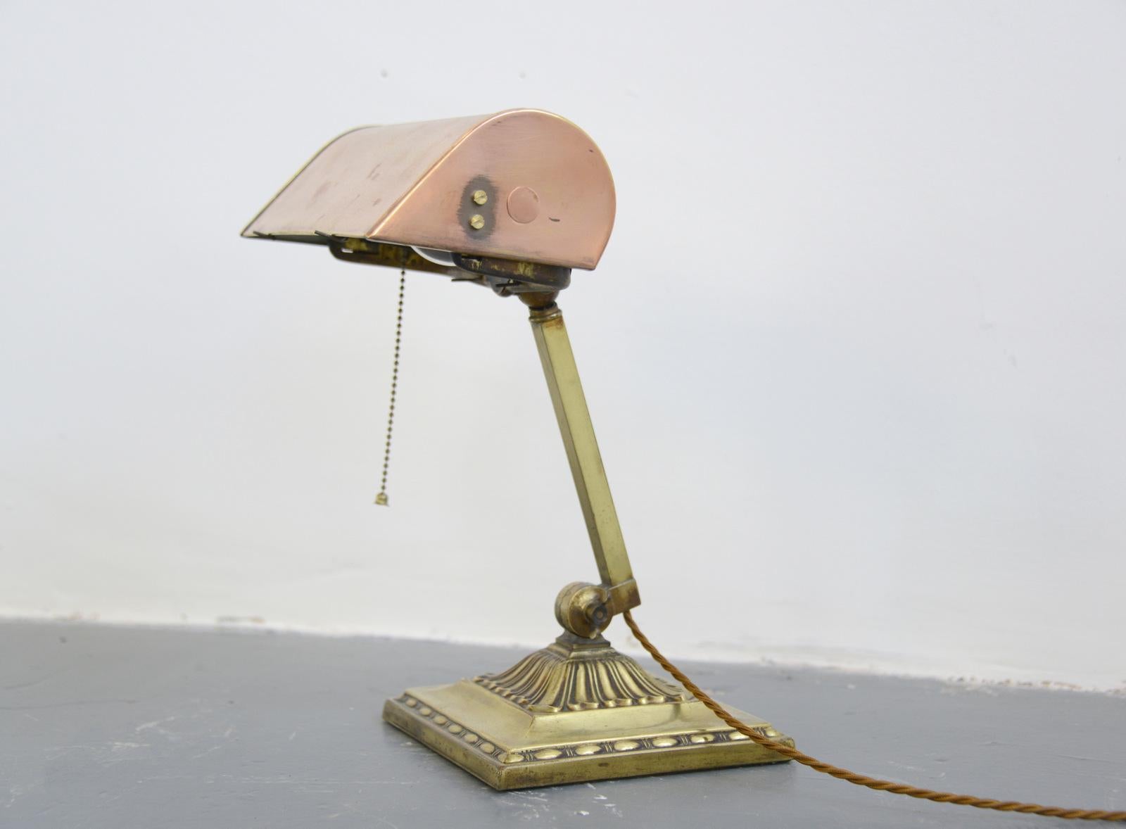 Emeralite NY desk lamp, circa 1910

- Copper shade
- Adjustable brass arm
- Original bulb holder
- Ornate base
- Made by HD McFaddin & Co., NY
- American, 1910
- Measures: 35 cm tall x 17 cm deep x 17 cm wide

Condition report:

Fully re