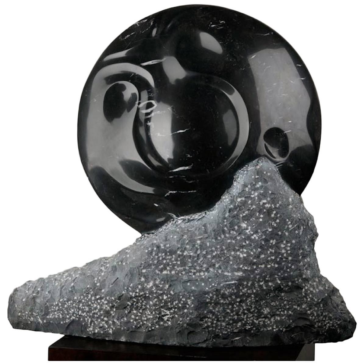 Emerging Sun, Black Marble Sculpture by Hector Alvarado For Sale