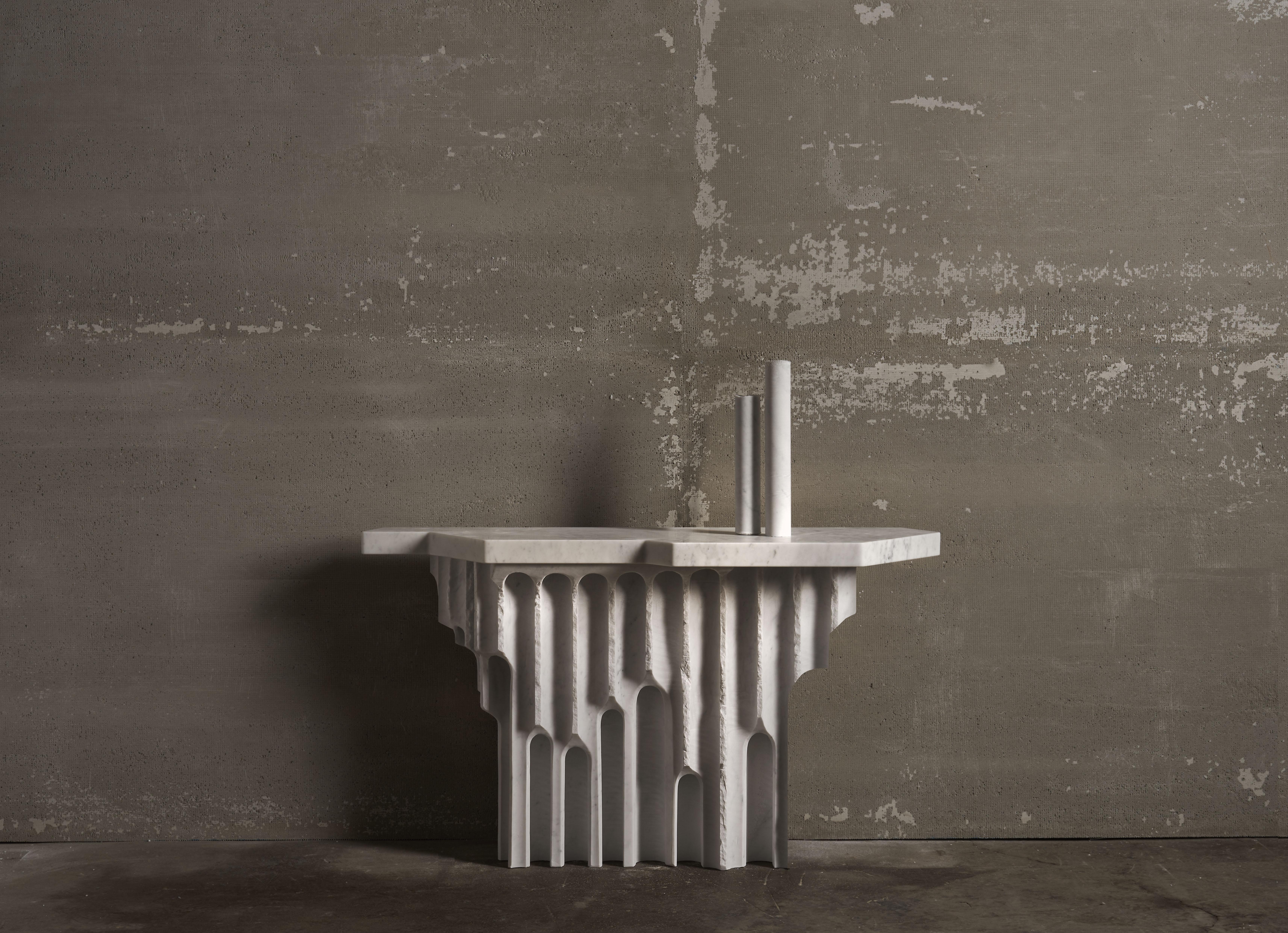 Emersa Console Table in Bianco Carrara Marble by Bufalini Marmi
Dimensions: D 42 x W 130 x H 75 cm. 
Materials: Carrara marble.

Console
The initial concept for this console arose from observing one of the most traditional methods used by workshops