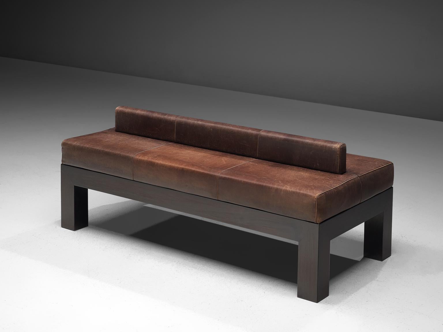 Emiel Veranneman, bench-sofa, brown buffalo leather and darkened oak, Belgium, 1960s

This wonderful custom made piece is designed by Emiel Veranneman for a private client. This functionalist bench with a robust solid oak frame shows a designs