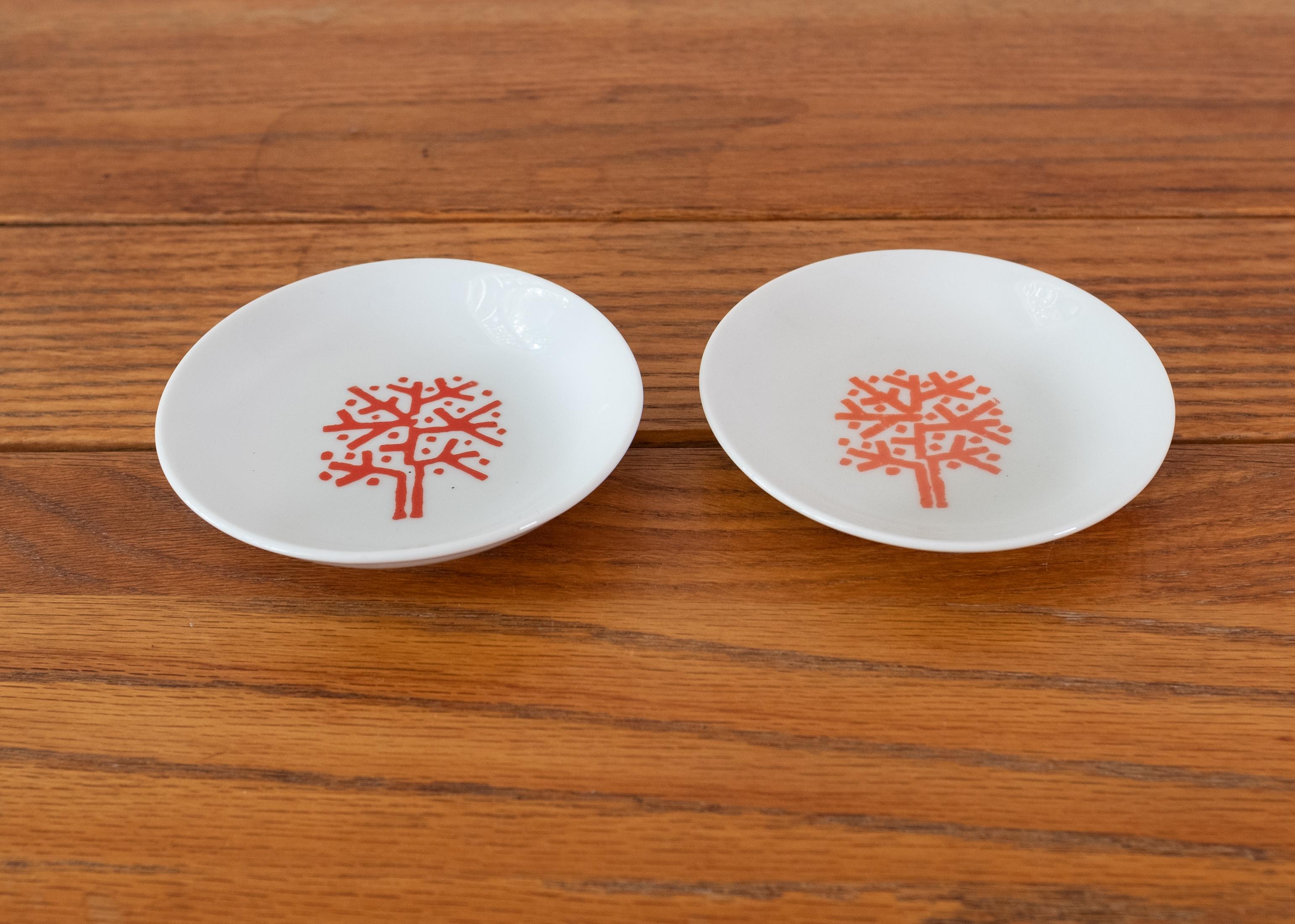 Two Emil Antonucci designed small catch-all plates or ashtrays for The Four Seasons hotel. Signed on the bottom.