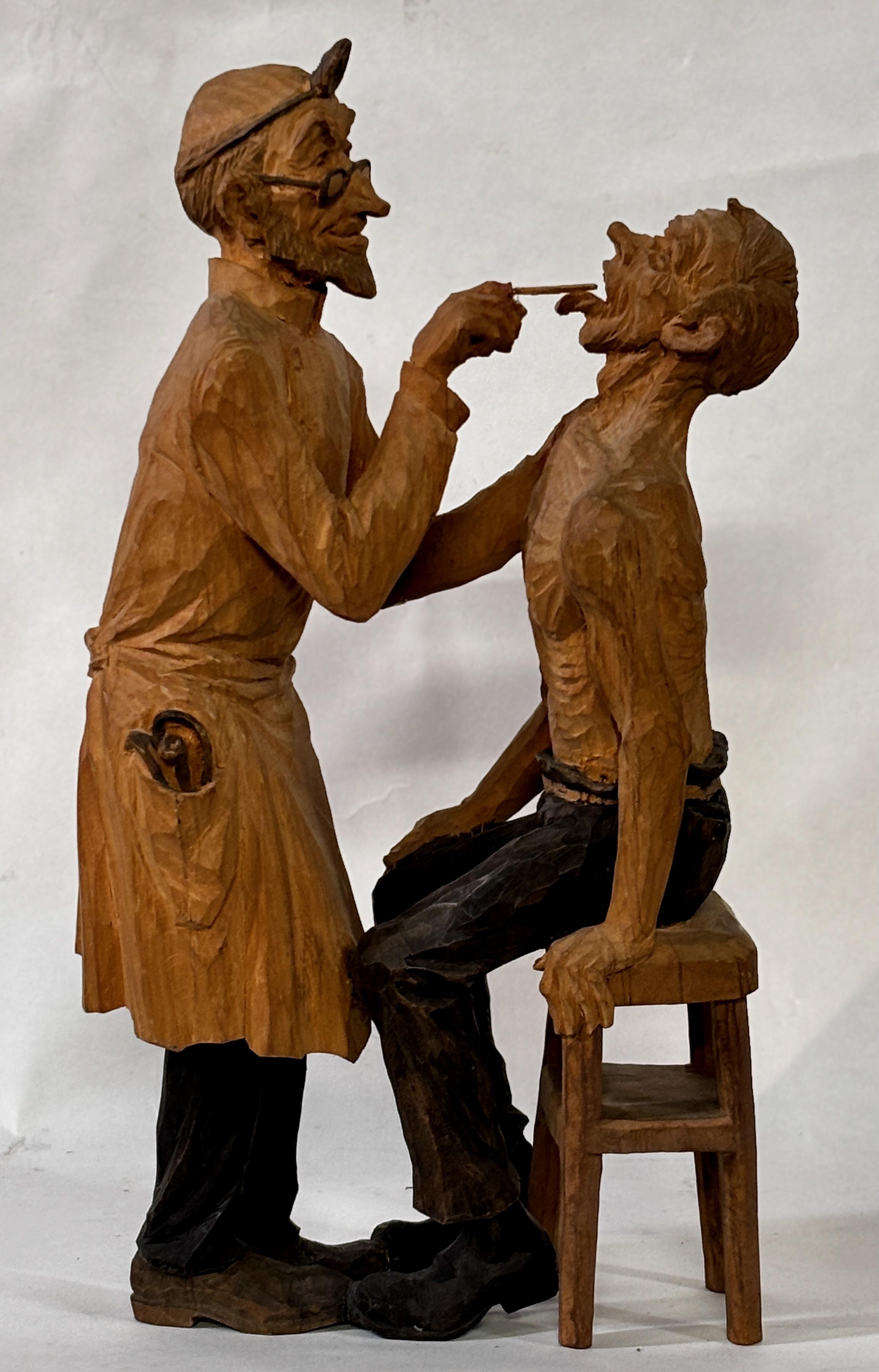 Talla detallada en madera caricaturesca de un dentista y un paciente, firmada Emil Janel.

Emil Janel fue un artista estadounidense de origen sueco. Pintor de naturalezas muertas, es conocido sobre todo por sus caricaturas en el estilo escandinavo