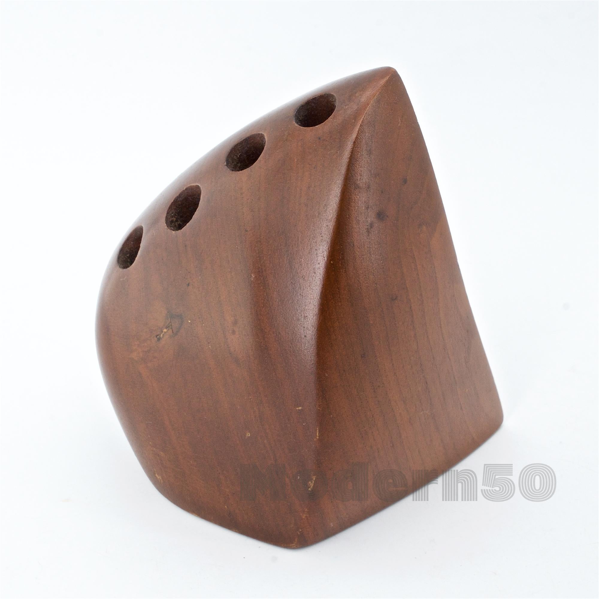 Uncommon form. Nice example of Emil Milan's sculptural work. Signed, EMilan Walnut.
 