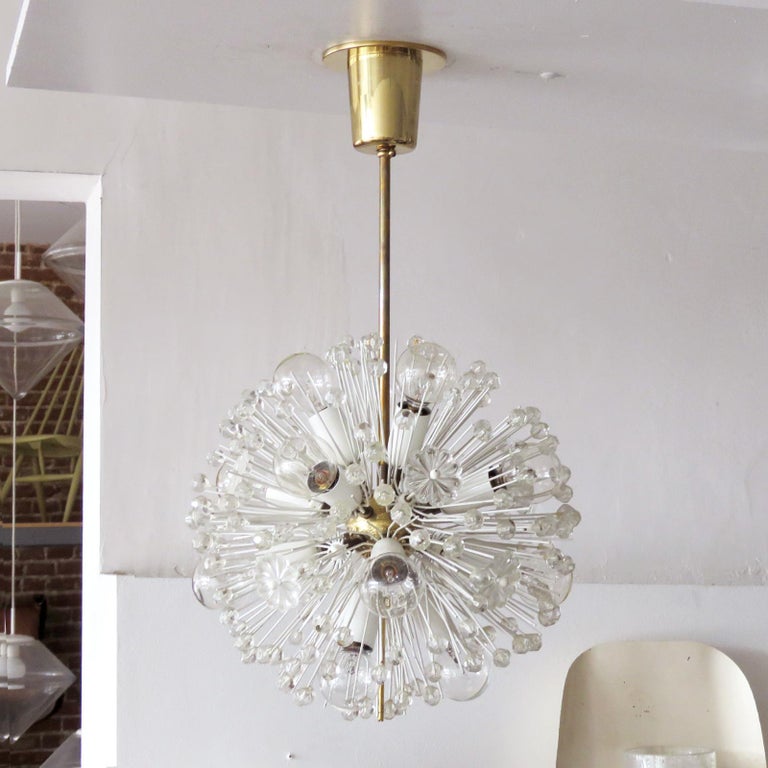 Beautiful and delicate fourteen-light brass fixture by Emil Stejnar for Nikoll with copious amounts of Austrian crystals, wired for US J-boxes, overall height can be adjusted, max. wattage 25 W per socket.