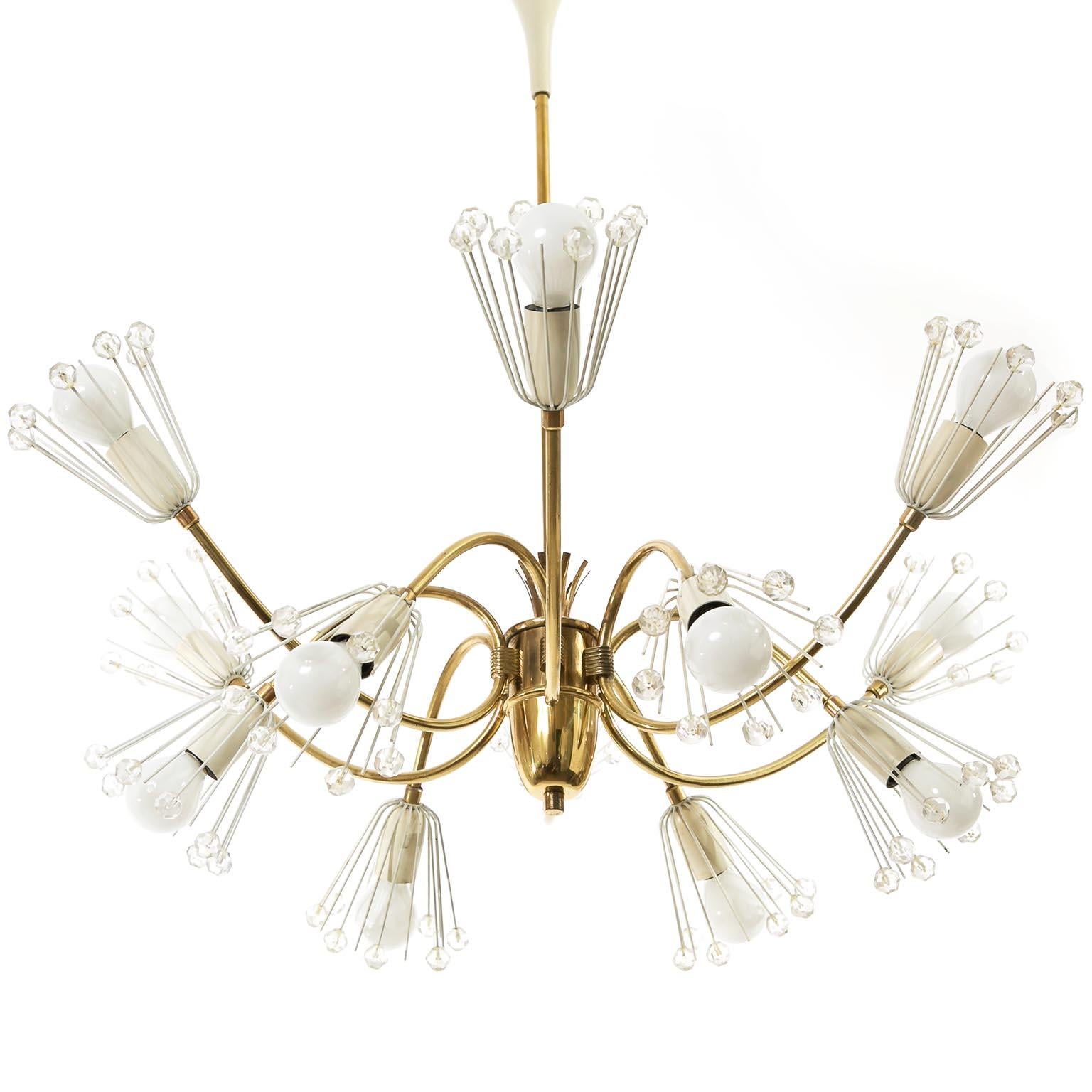 A beautiful 'Snowflake' chandelier / pendant light by Emil Stejnar for Rupert Nikoll, Austria, Vienna, manufactured in midcentury, circa 1950.
It is made of brass with nice patina on it, white lacquered metal and hand-cut crystal glass. The fixture