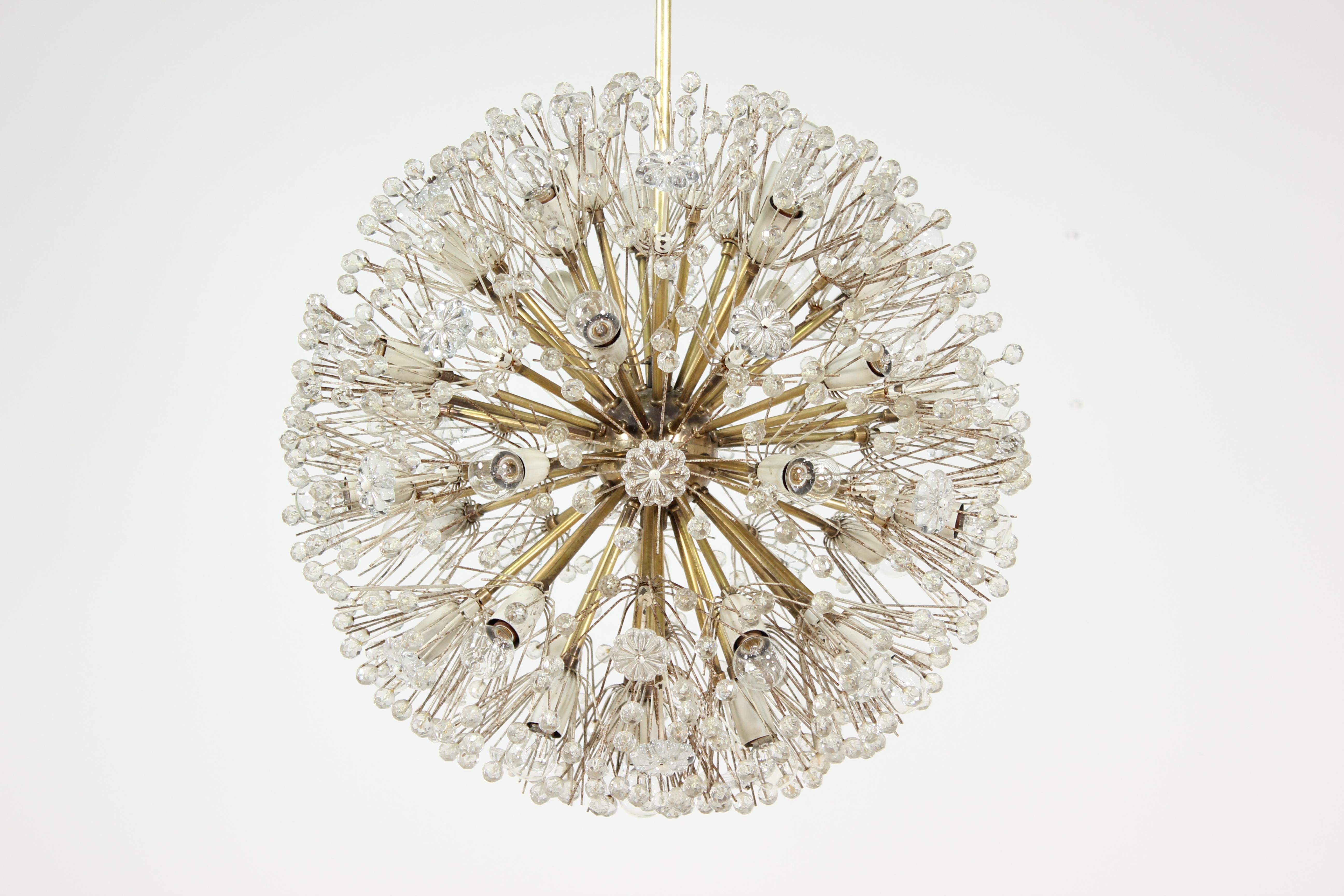 Spectacular, 1960s Emil Stejnar “Dandelion” chandelier for Rupert Nikoll, Austria. This sparkling orb is one of the larger versions of this design. The chandelier consists of a brass body and arms with white enameled socket covers (each surrounded