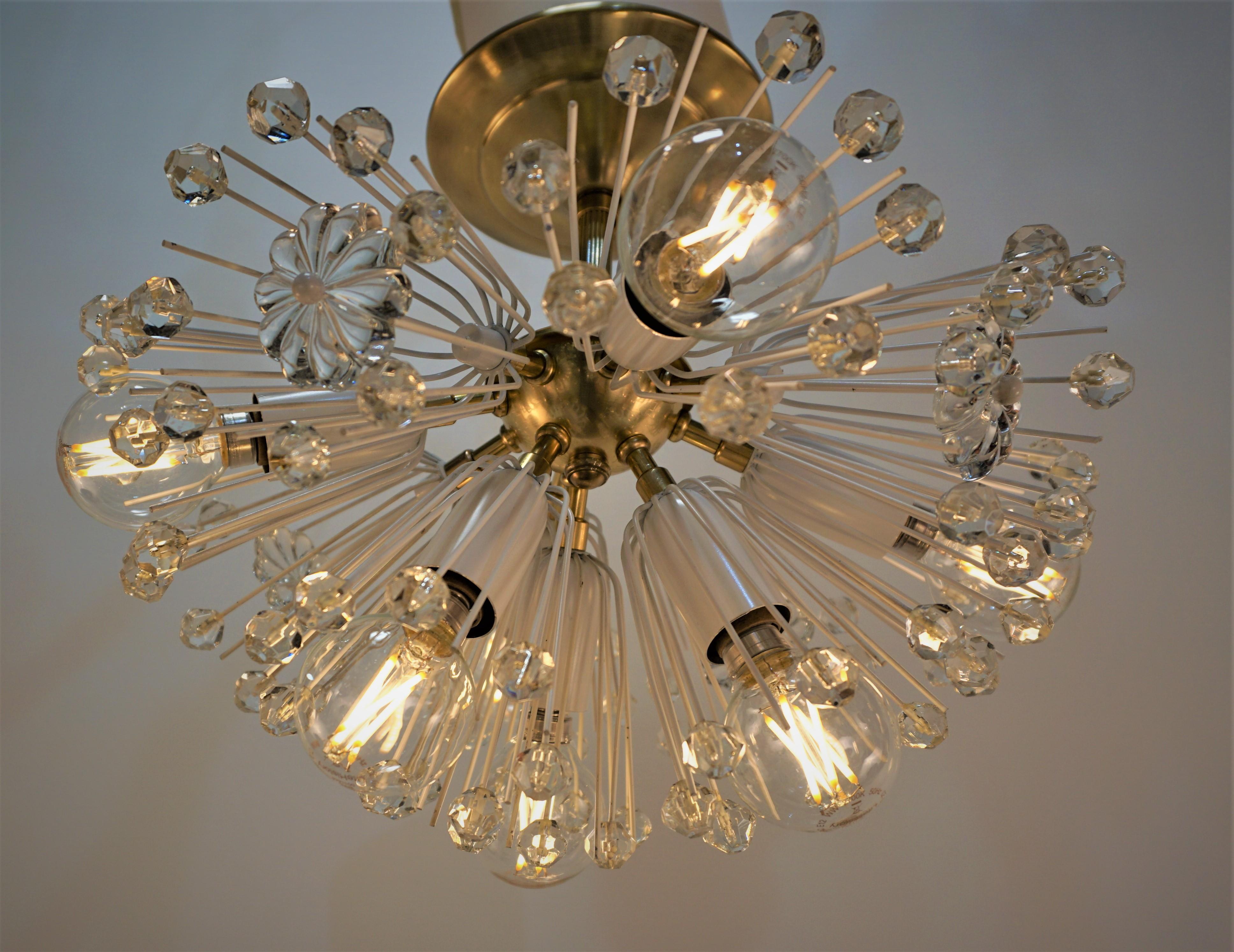 Dandelion design semi flush Sputnik crystal and bronze chandelier.
Height is 14