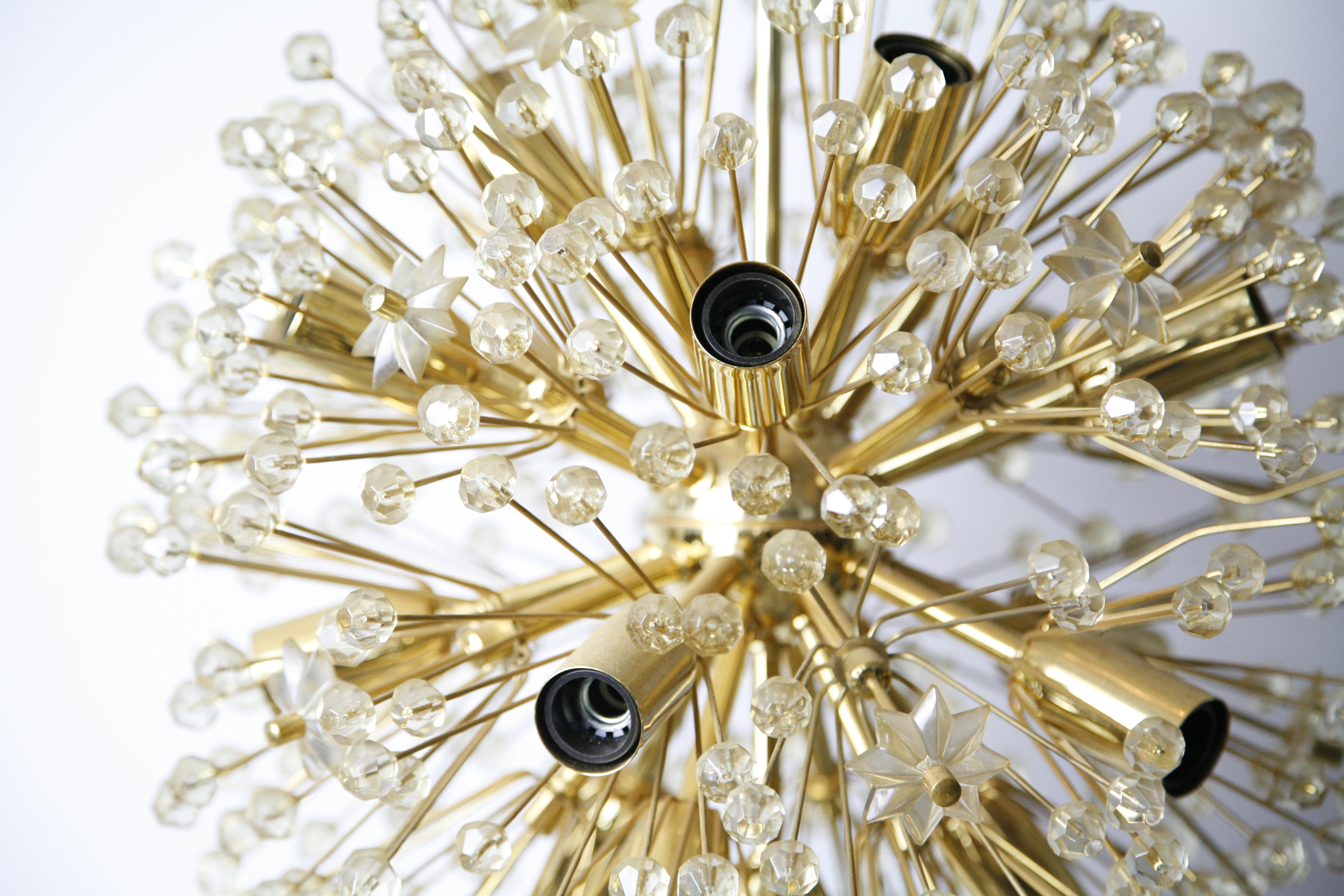 Emil Stejnar for Rupert Nikoll brass and glass Sputnik chandelier, Austria, 1950.
Sputnik chandelier consisting of a brass frame with numerous glass elements in the shape of stars and glass ballslid up by 16 individual bulbs E14