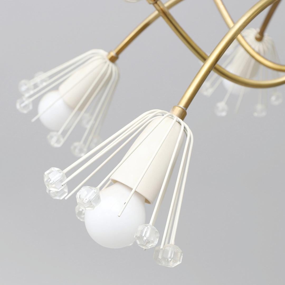 Emil Stejnar for Rupert Nikoll brass and glass  chandelier, Austria, 1950.
Chandelier consisting of a brass frame with numerous glass elements in the shape of stars and glass ball slid up by 12 individual bulbs .