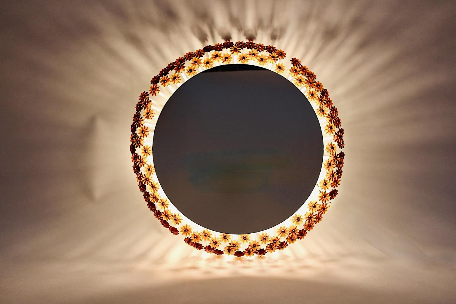 Mid-Century Modern vintage circular like wall mirror backlit framed with lucite flowers in amber color tone by Emil Stejnar 1950s Austria.
The wall mirror is lighted with three E 14 sockets. Amazing lucite flowers work in soft brown luscious amber