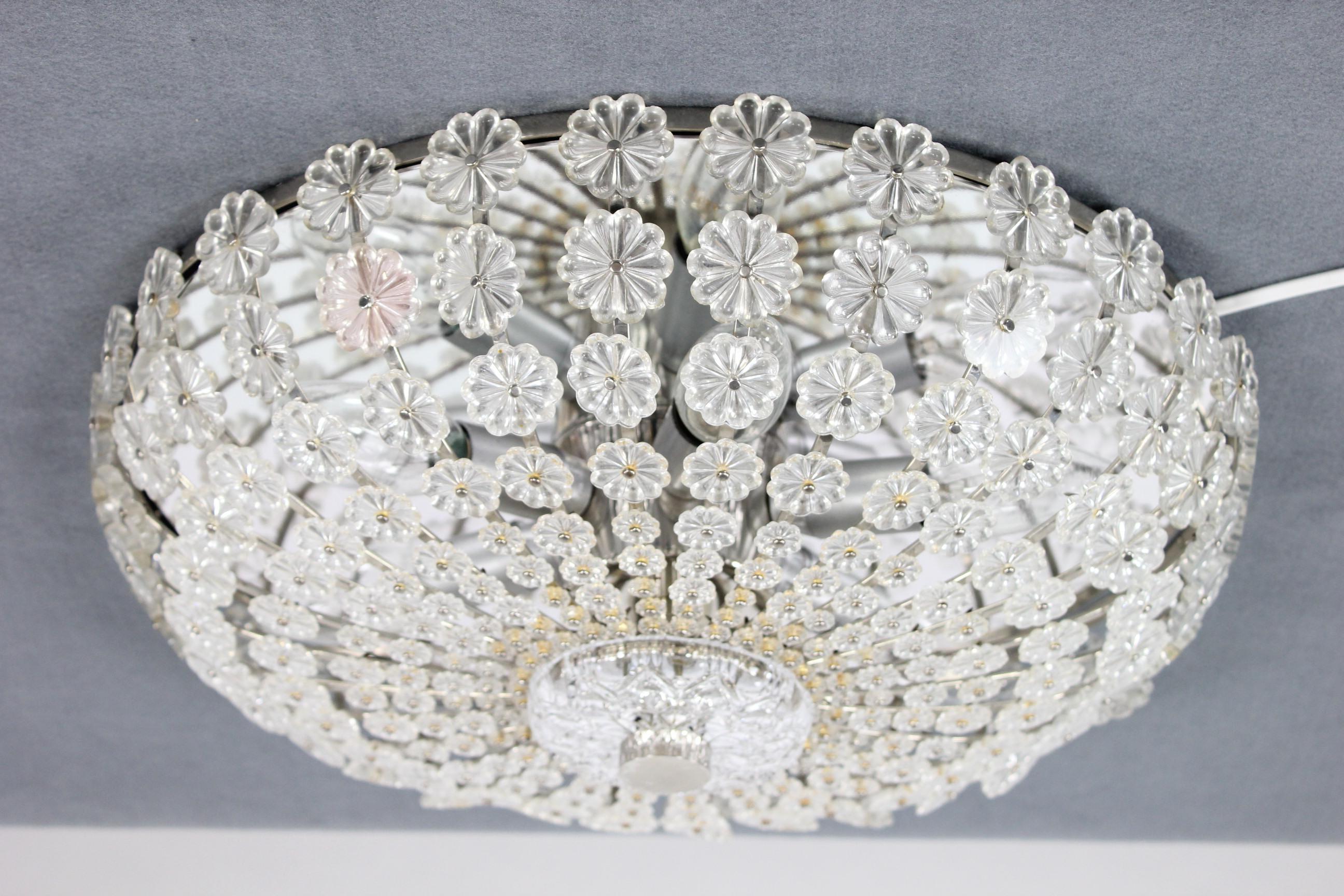 Ruppert Nikoll ceiling fixture glass blossom light
Design Emil Stejnar at the 1950s
in fine complete condition with 270 glass blossoms
only the chromed surface of the screw into the center is peeling of
diameter 16.5'' height 5'' weight 2.9