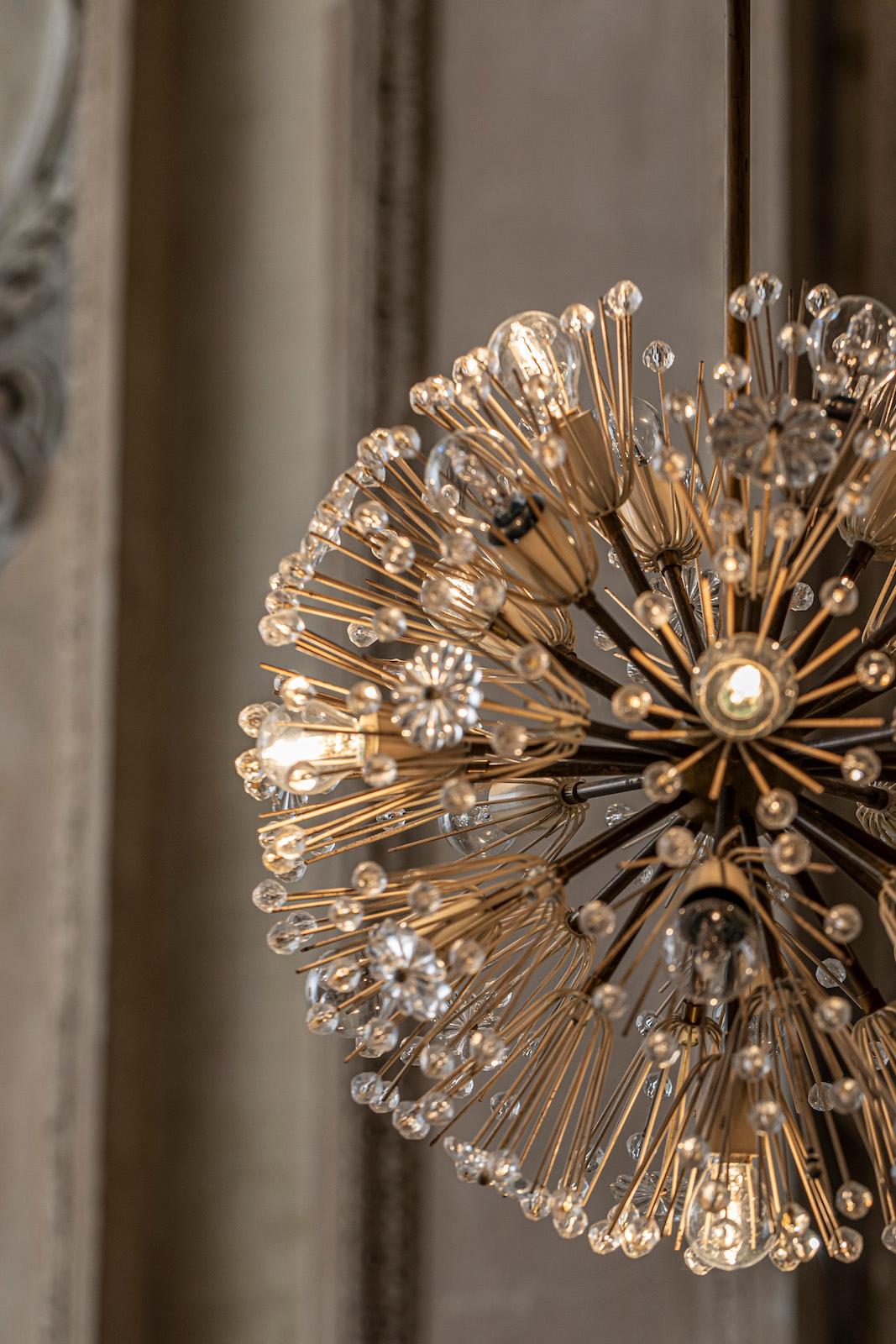 Elegant 18 lights Sputnik chandelier by Emil Stejnar.
Brass and glass charming pendant.
Very good original condition.